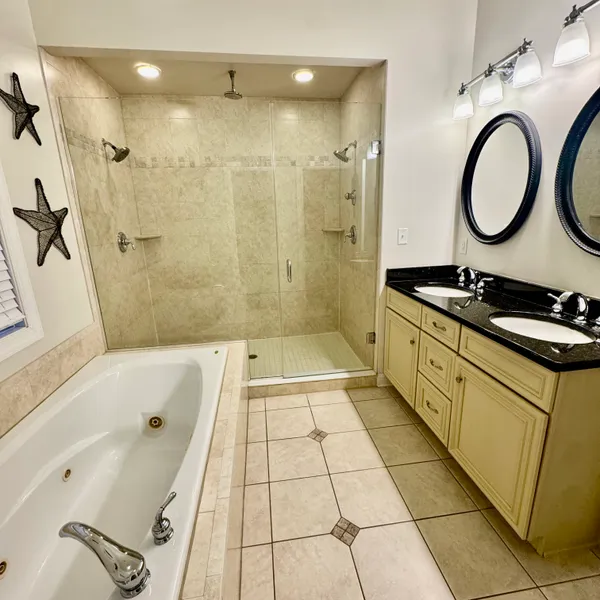 a bedroom with a bed and a potted plant