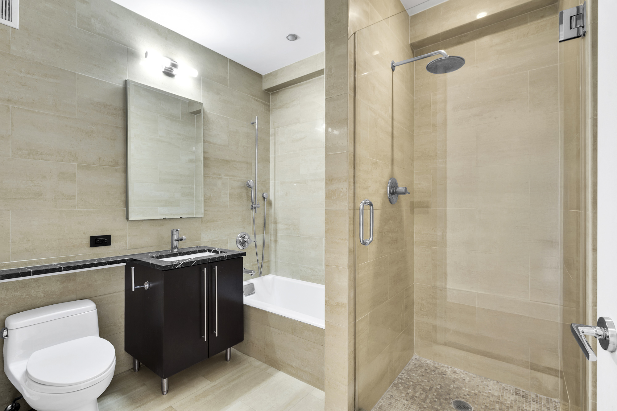 267 West 124th Street, Unit 6A Manhattan, NY 10027 - Photo 21 of 24 a bathroom with a toilet a sink and shower