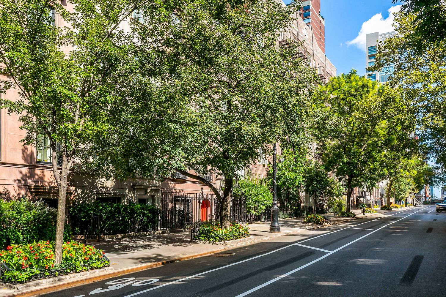 209 East 61st Street Manhattan, NY 10065 - Photo 23 of 24 a view of street with plants and trees