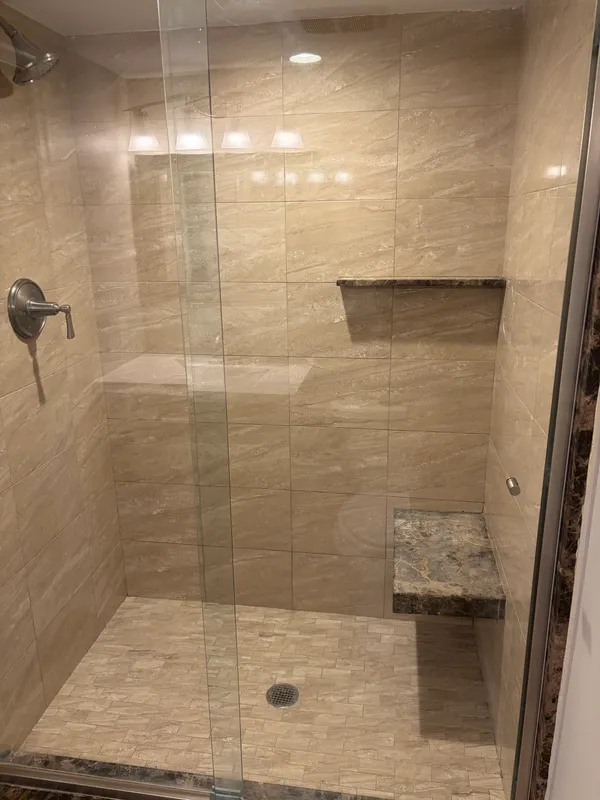 a white toilet sitting next to a bathroom sink