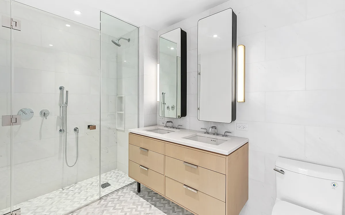 181 18th Street, Unit 408 Brooklyn, NY 11215 - Photo 3 of 13 a bathroom with a double vanity sink mirror and shower