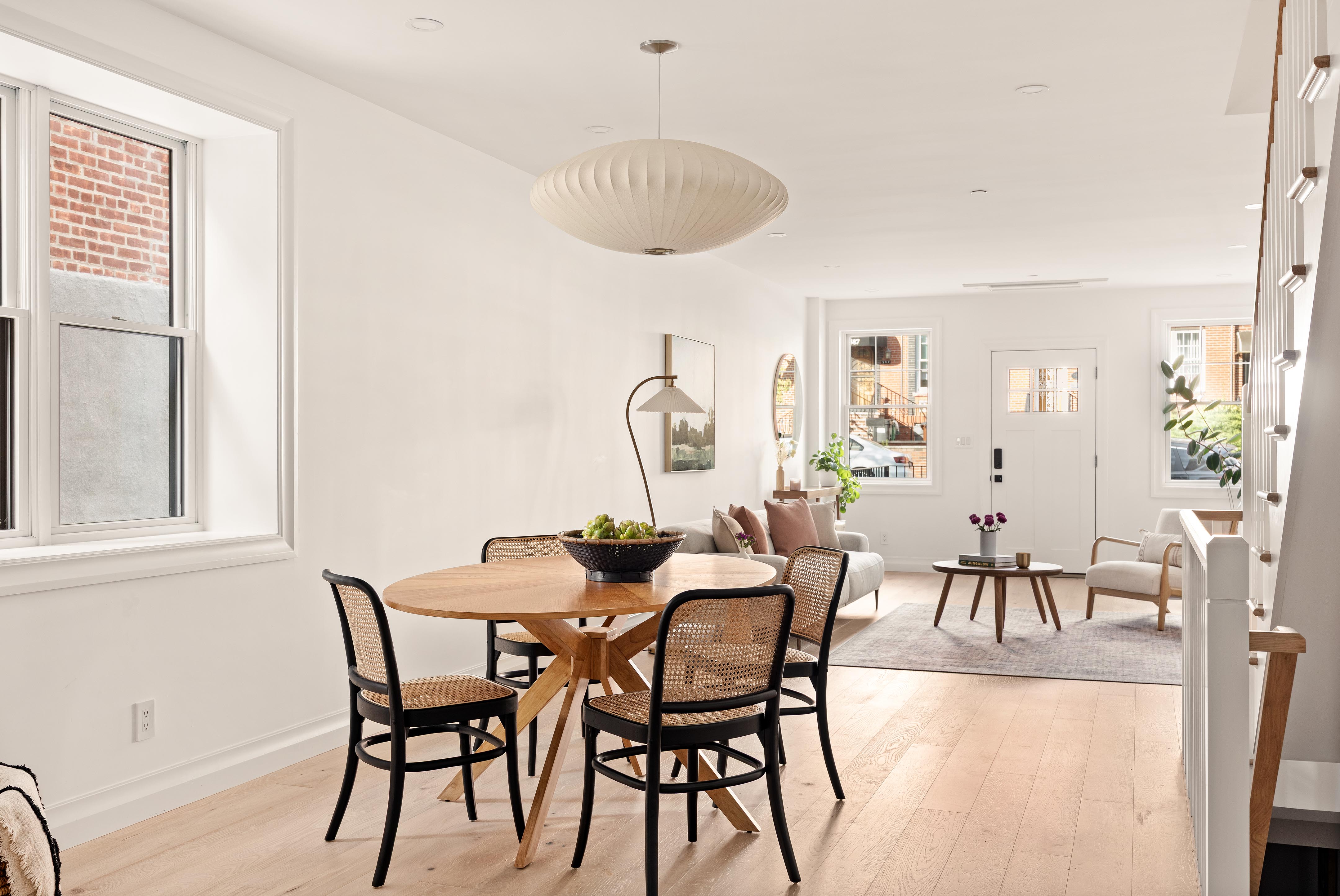 578 20th Street Brooklyn, NY 11218 - Photo 4 of 24 a view of a dining room with furniture and a potted plant