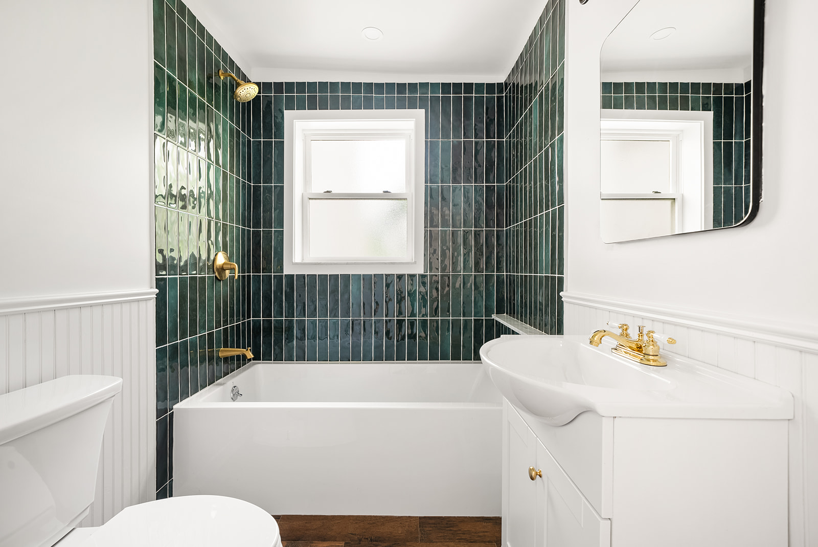 211 12th Street, Unit 2 Brooklyn, NY 11215 - Photo 5 of 7 a bathroom with a bathtub sink and toilet