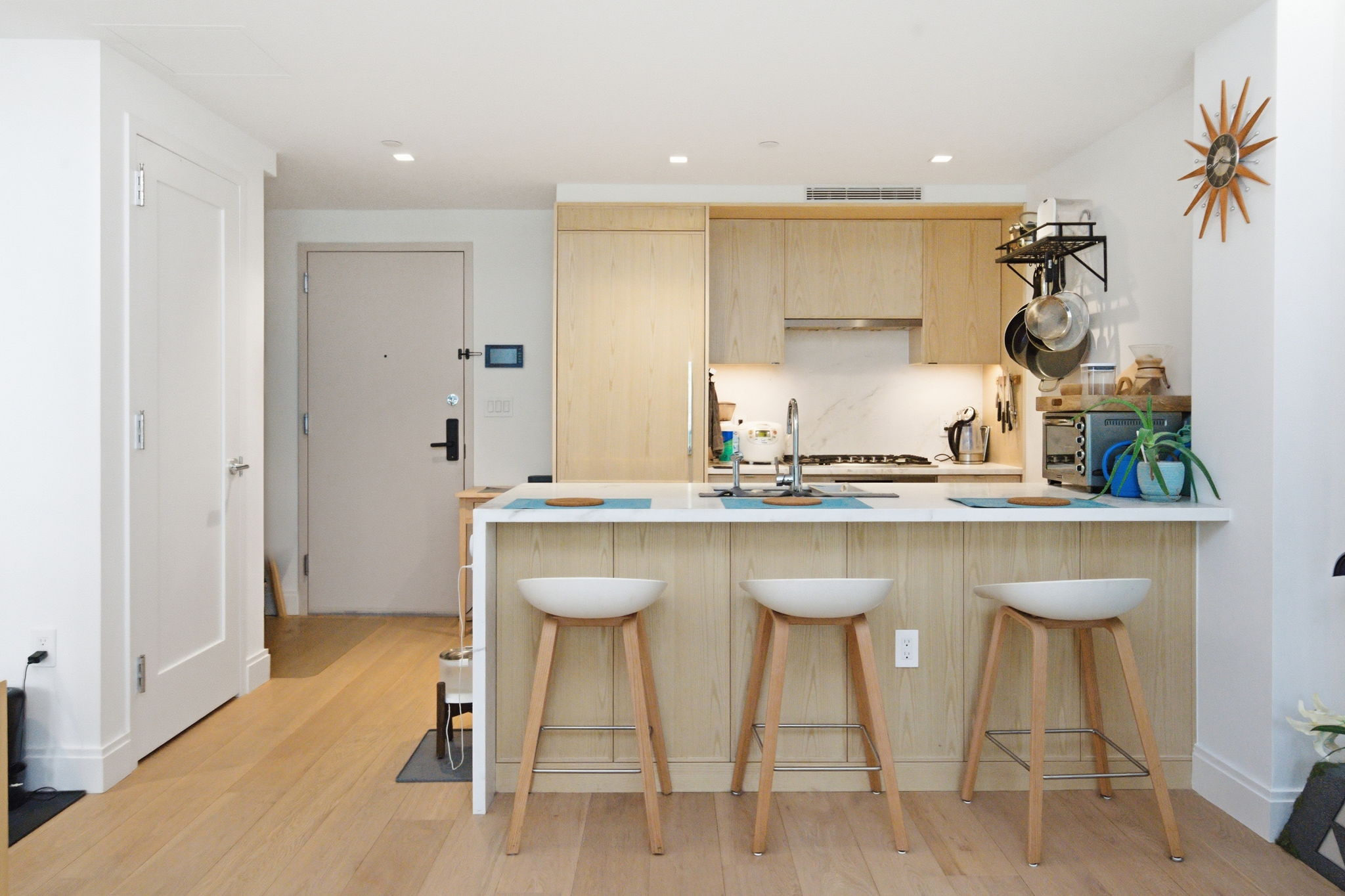 37-14 34th Street, Unit N3E Queens, NY 11101 - Photo 5 of 18 a kitchen with a sink and chairs