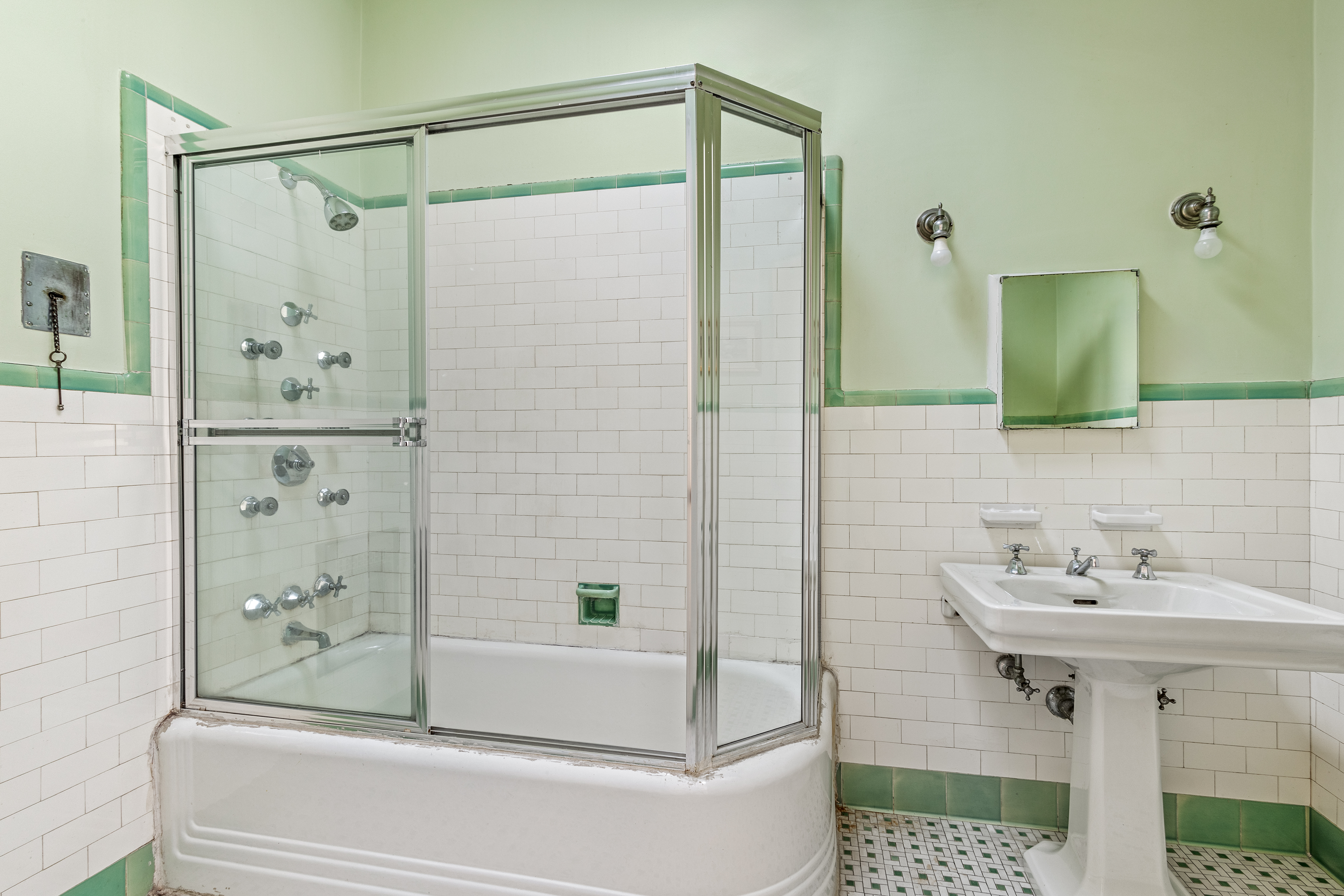599 2nd Street Brooklyn, NY 11215 - Photo 14 of 16 a bathroom with a sink and shower