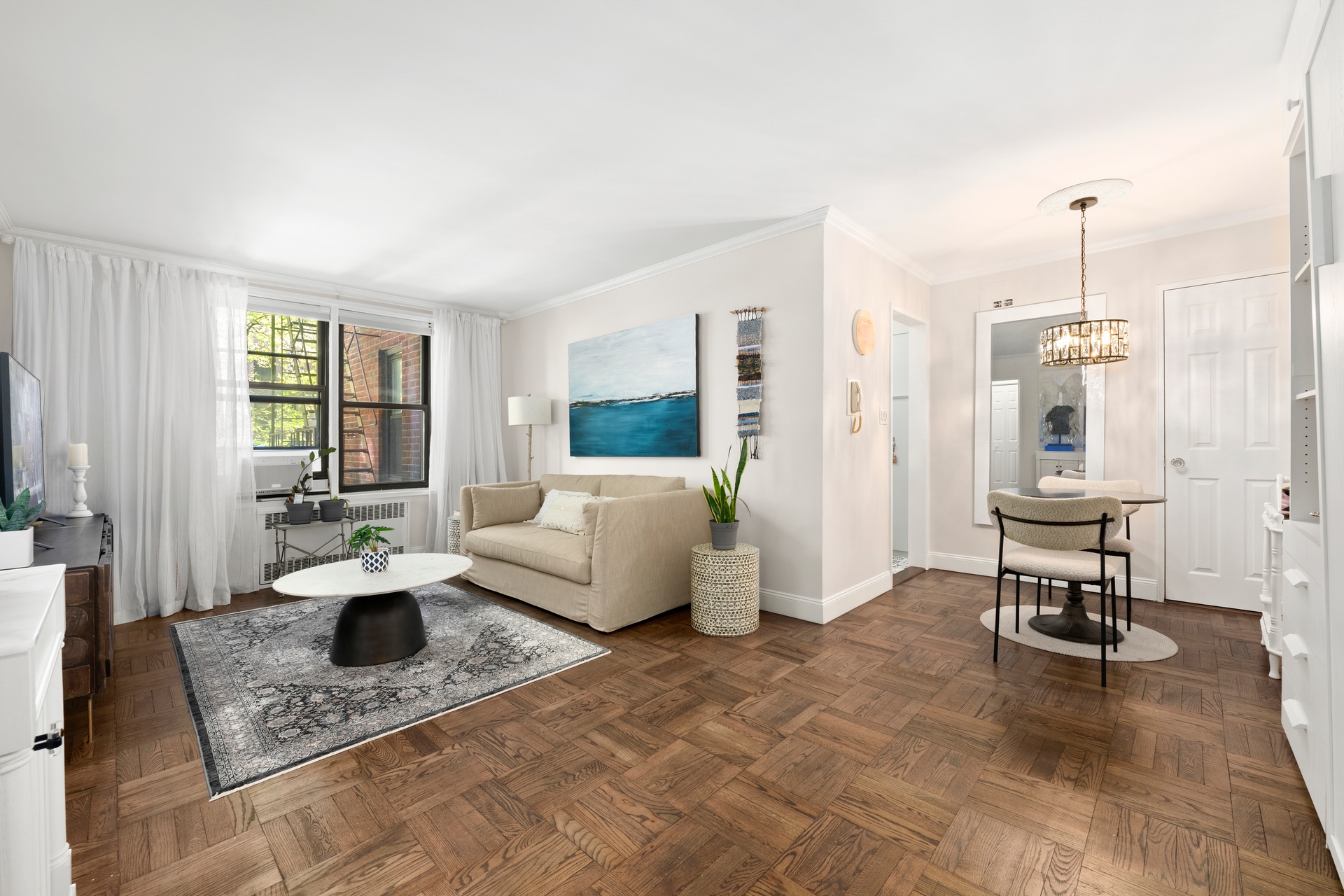 330 East 80th Street, Unit 2F Manhattan, NY 10075 - Photo 2 of 7 a living room with furniture and a table