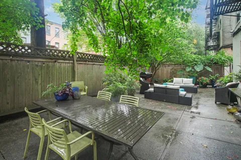 a view of a patio with couple of chairs
