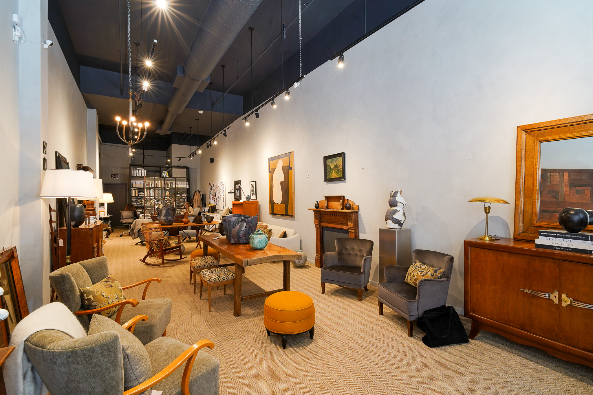 129 Duane Street, Unit RETAIL Manhattan, NY 10013 - Photo 4 of 7 a living room with lots of furniture and gym equipment