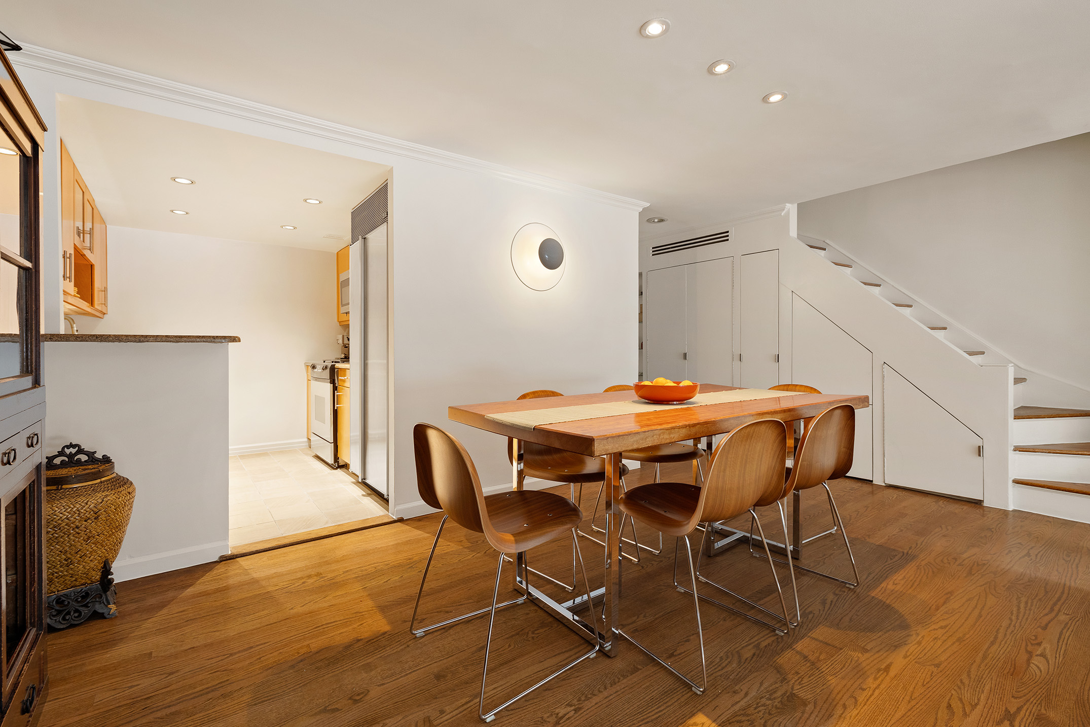 39 East 75th Street, Unit 1E Manhattan, NY 10021 - Photo 5 of 14 a dining room with furniture and wooden floor