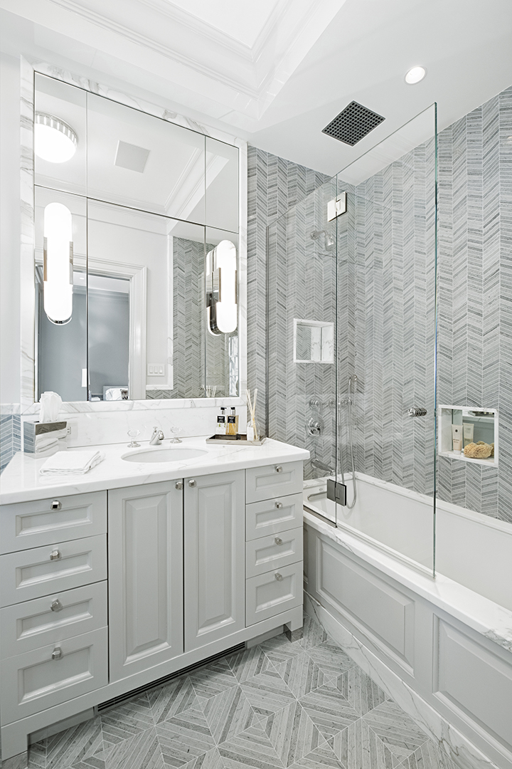 730 Park Avenue, Unit 7/8A Manhattan, NY 10021 - Photo 20 of 26 a bathroom with a double vanity sink mirror and bathtub