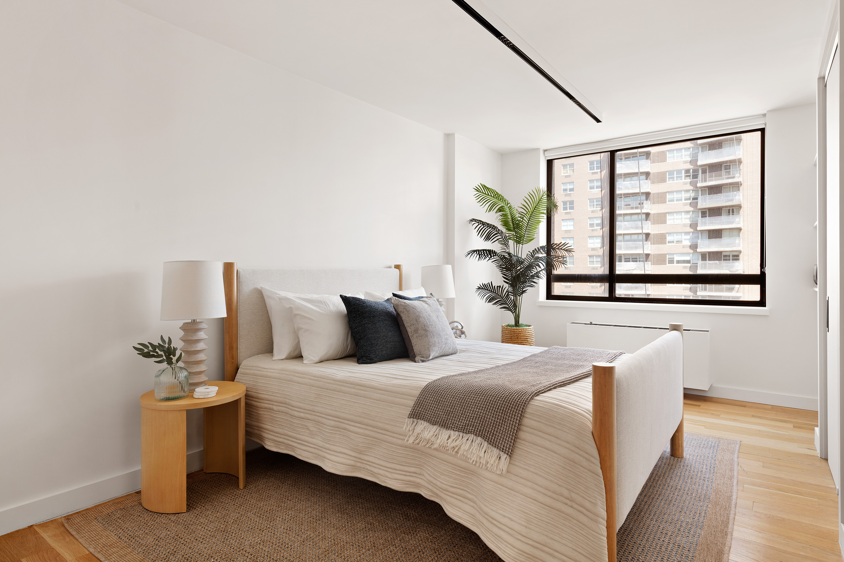 171 East 84th Street, Unit 25B/C Manhattan, NY 10028 - Photo 8 of 13 a bedroom with bed and window