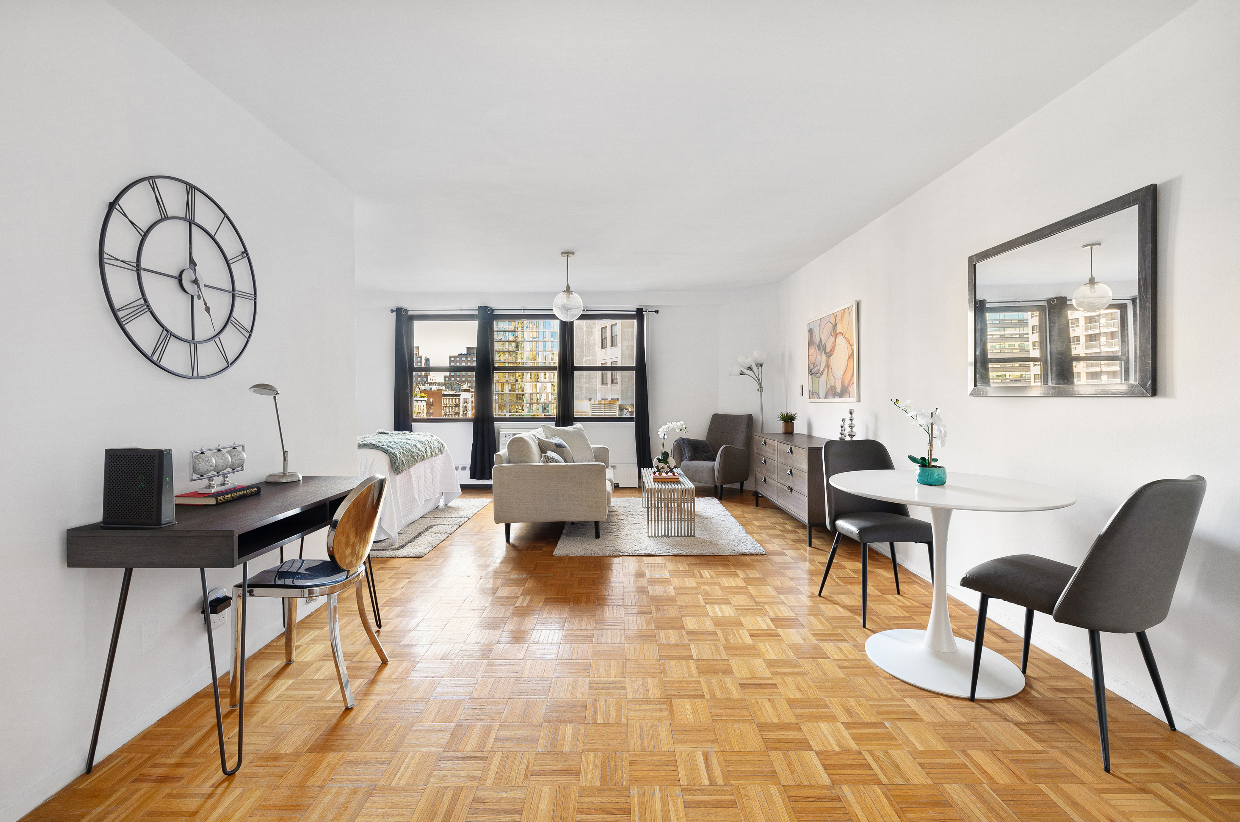 145 East 15th Street, Unit 7C Manhattan, NY 10003 - Photo 5 of 10 a living room with fireplace furniture and a window