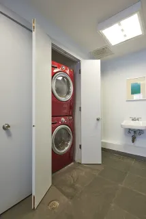 a utility room with sink dryer and washer