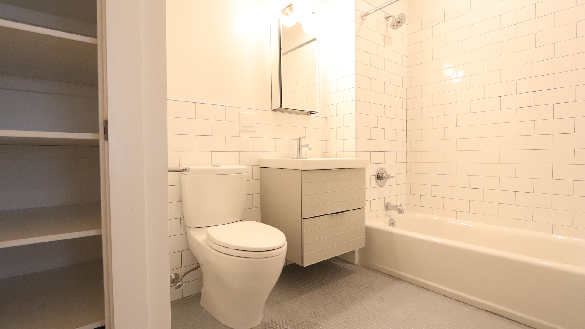 353 12th Street, Unit 3 Brooklyn, NY 11215 - Photo 6 of 13 a bathroom with a toilet and a bathtub