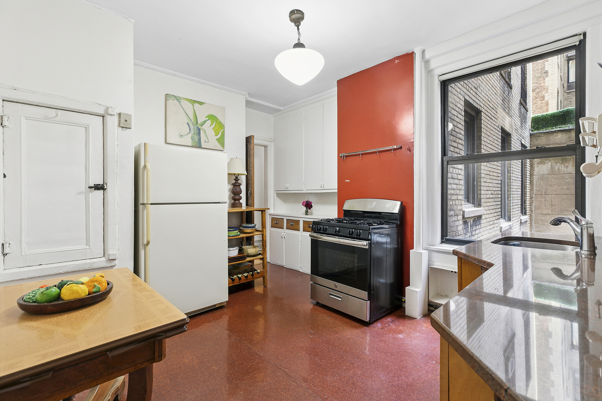 160 West 95th Street, Unit 4A Manhattan, NY 10025 - Photo 4 of 10 a kitchen with stainless steel appliances granite countertop a refrigerator and a stove top oven