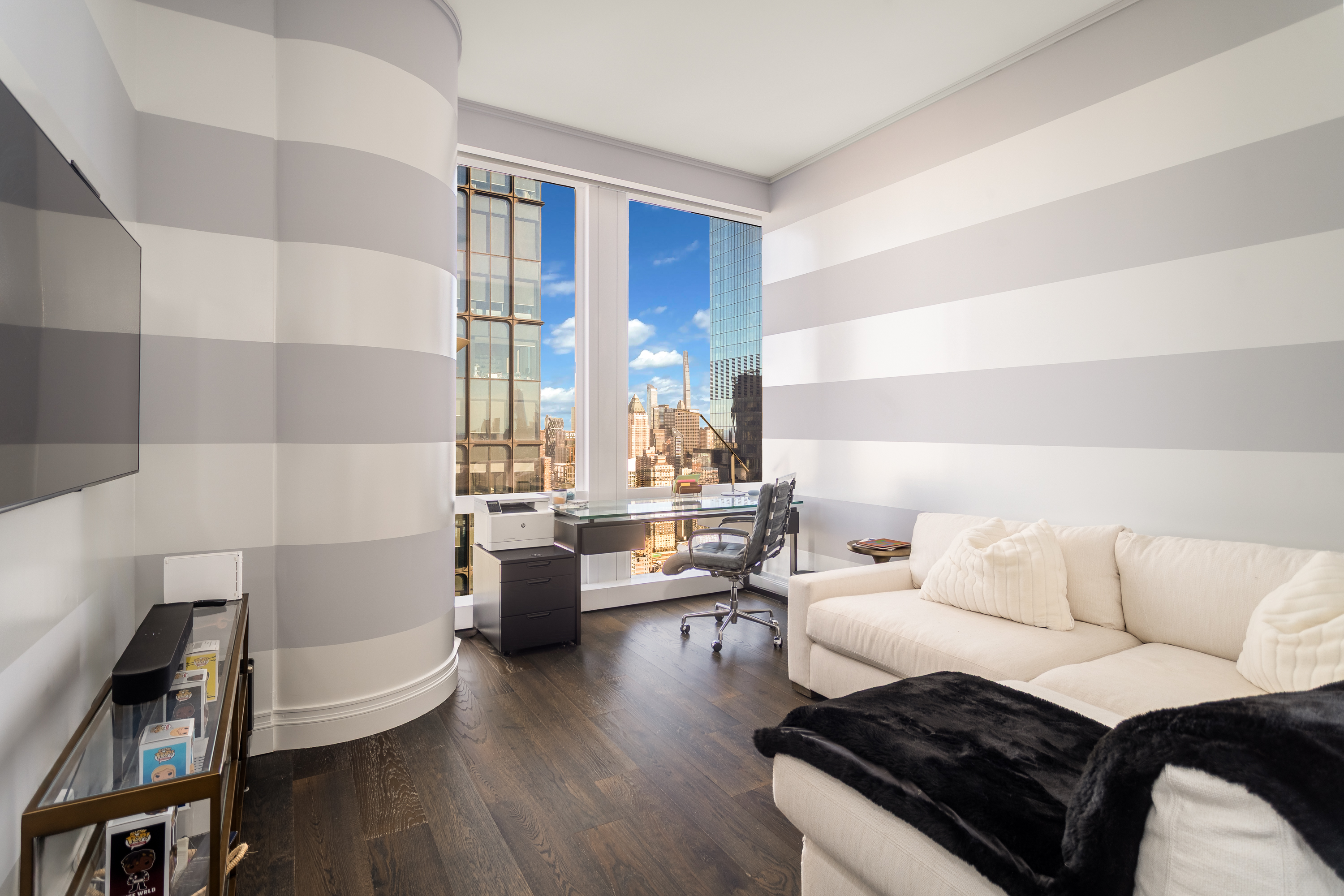 35 Hudson Yards, Unit 5903 Manhattan, NY 10001 - Photo 12 of 15 a living room with furniture and wooden floor