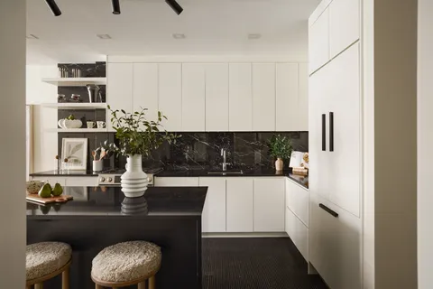 a kitchen with a table and chairs in it
