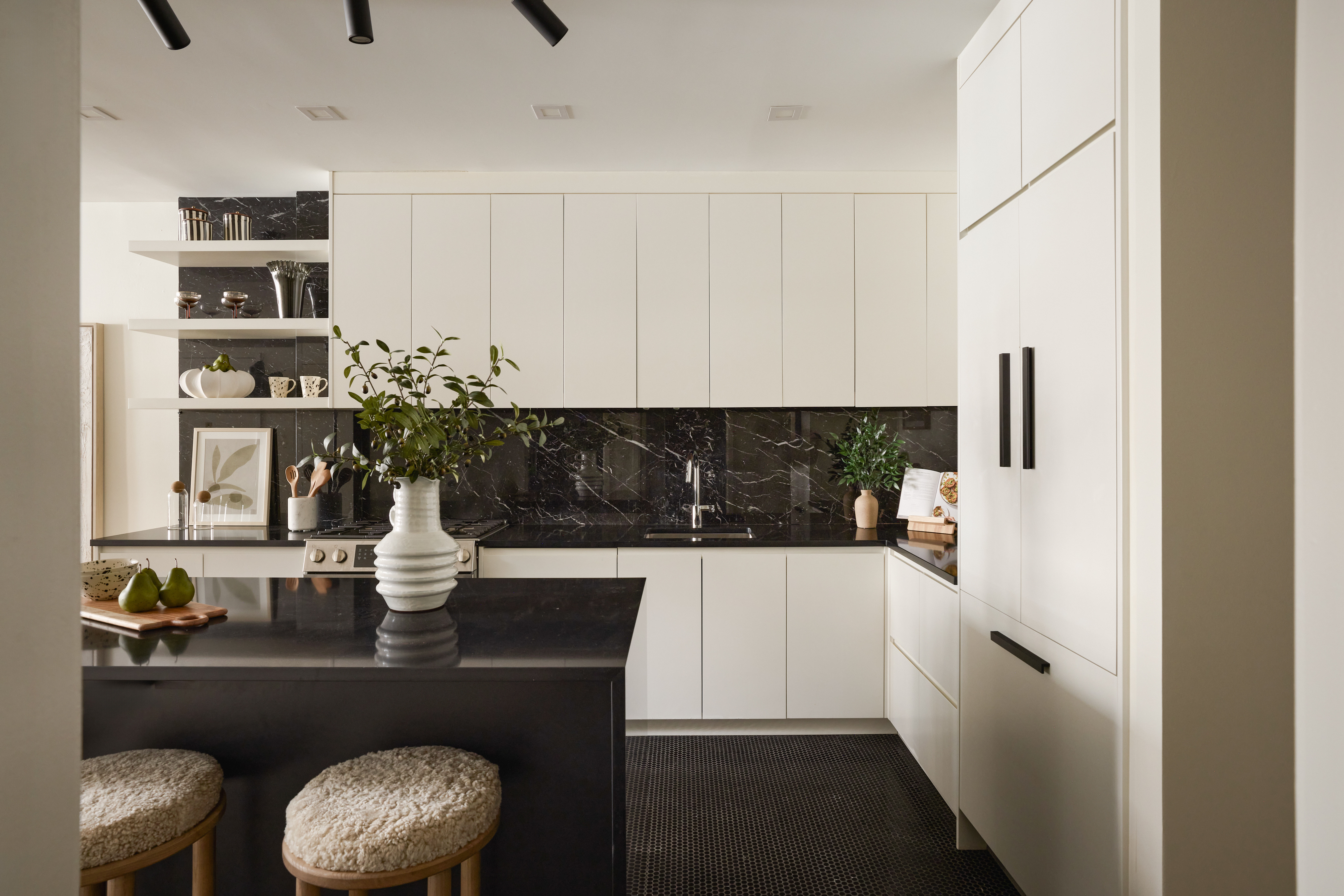 112 Hudson Street, Unit 3 Manhattan, NY 10013 - Photo 4 of 11 a kitchen with a table and chairs in it