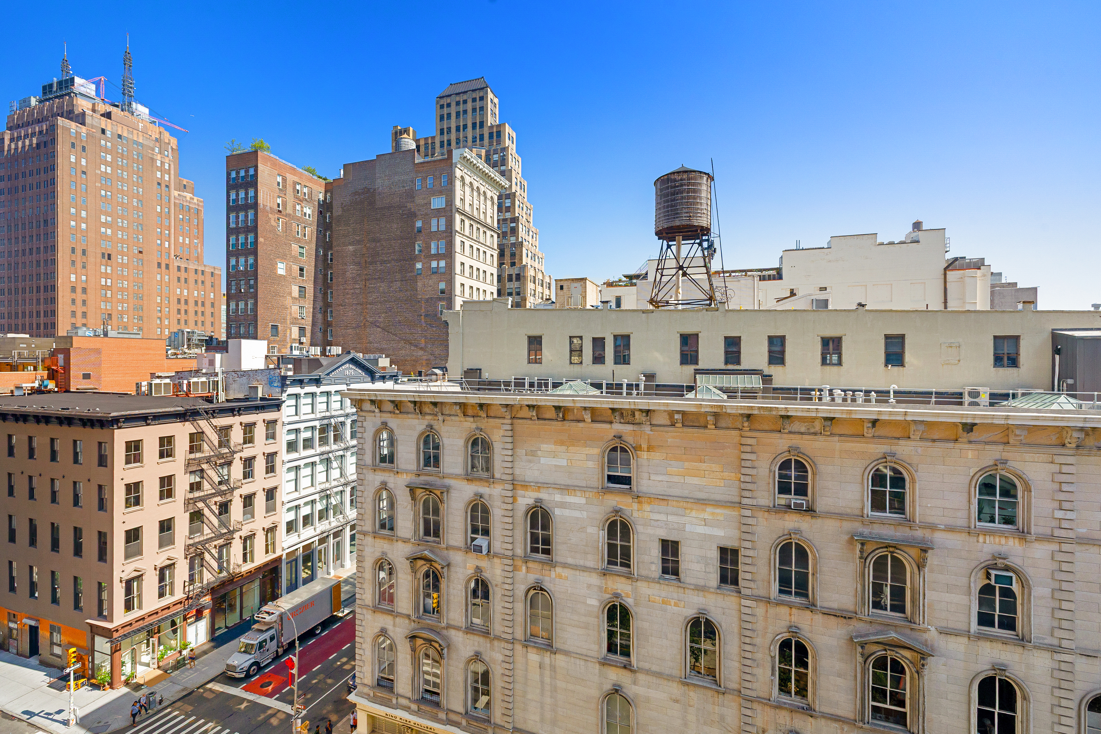 376 Broadway, Unit 9D Manhattan, NY 10013 - Photo 3 of 8 a large building with a clock on the wall