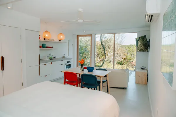 a kitchen with a sink a stove and cabinets