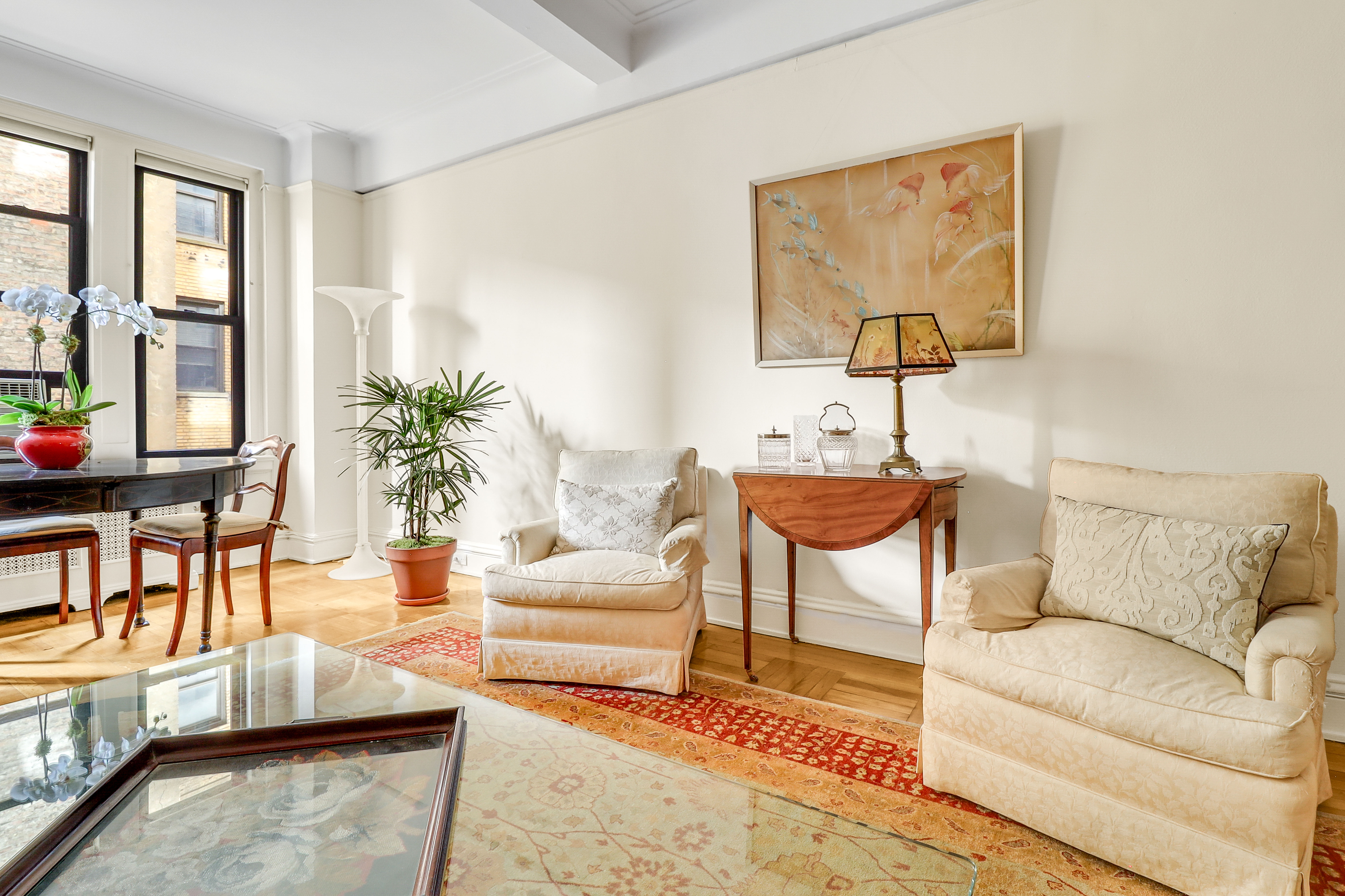 50 Riverside Drive, Unit 5E Manhattan, NY 10024 - Photo 3 of 22 a living room with furniture and a potted plant