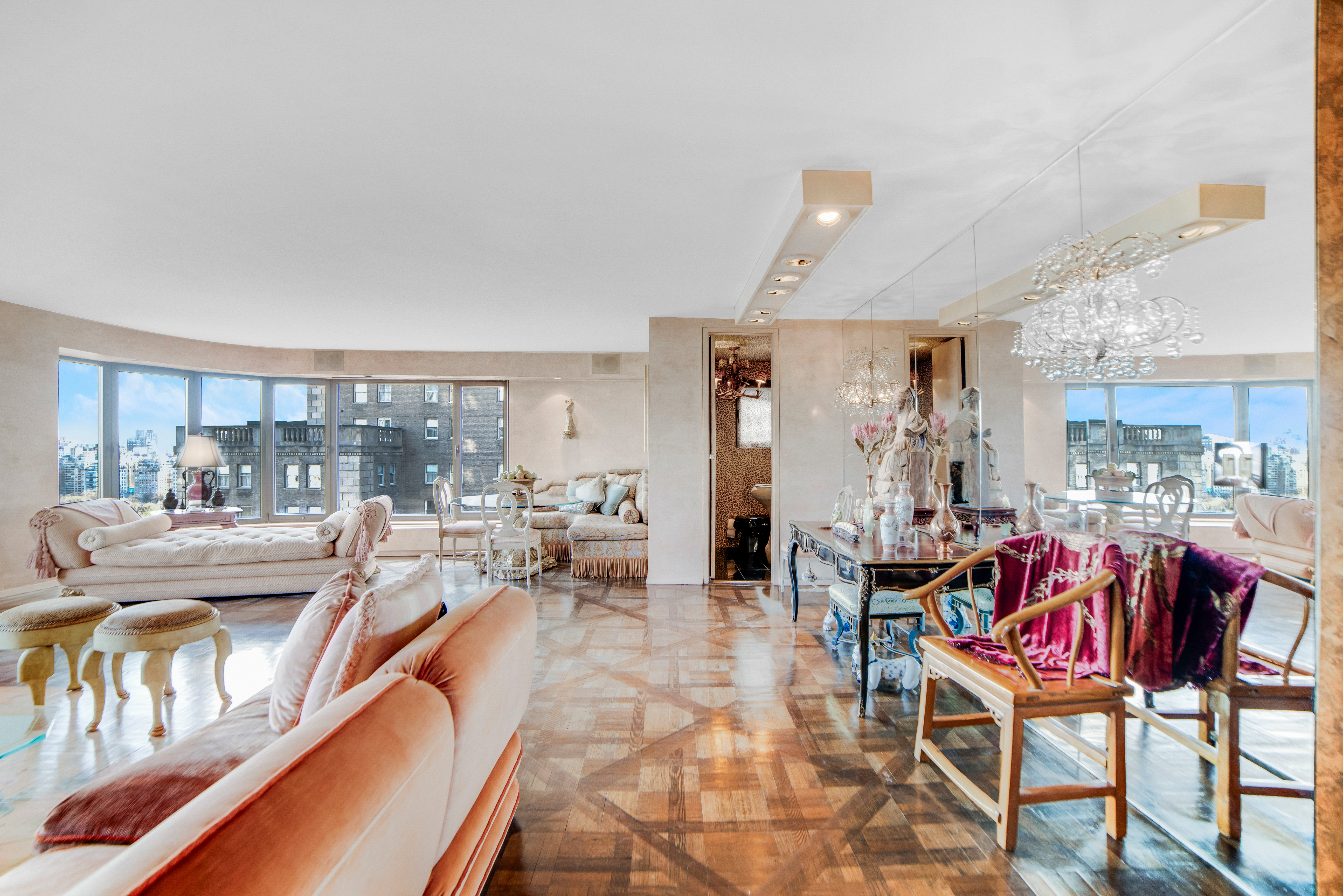 200 Central Park South, Unit 24A Manhattan, NY 10019 - Photo 5 of 23 a living room with furniture and a large window