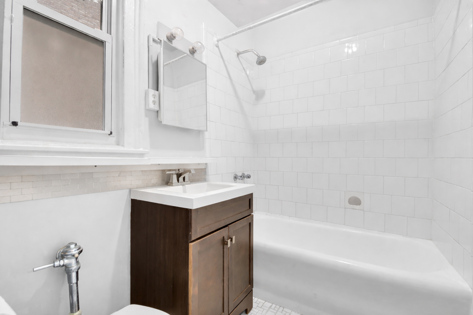 720 West 173rd Street, Unit 23 Manhattan, NY 10032 - Photo 9 of 10 a bathroom with a sink a toilet and bathtub