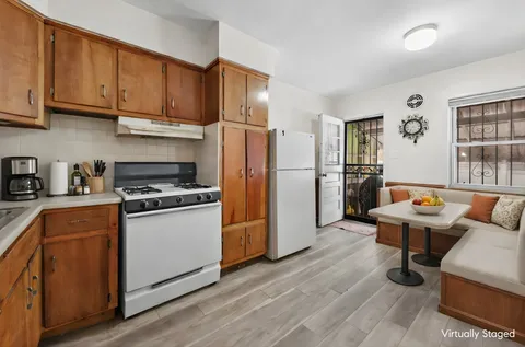 a kitchen with stainless steel appliances a stove a refrigerator and cabinets