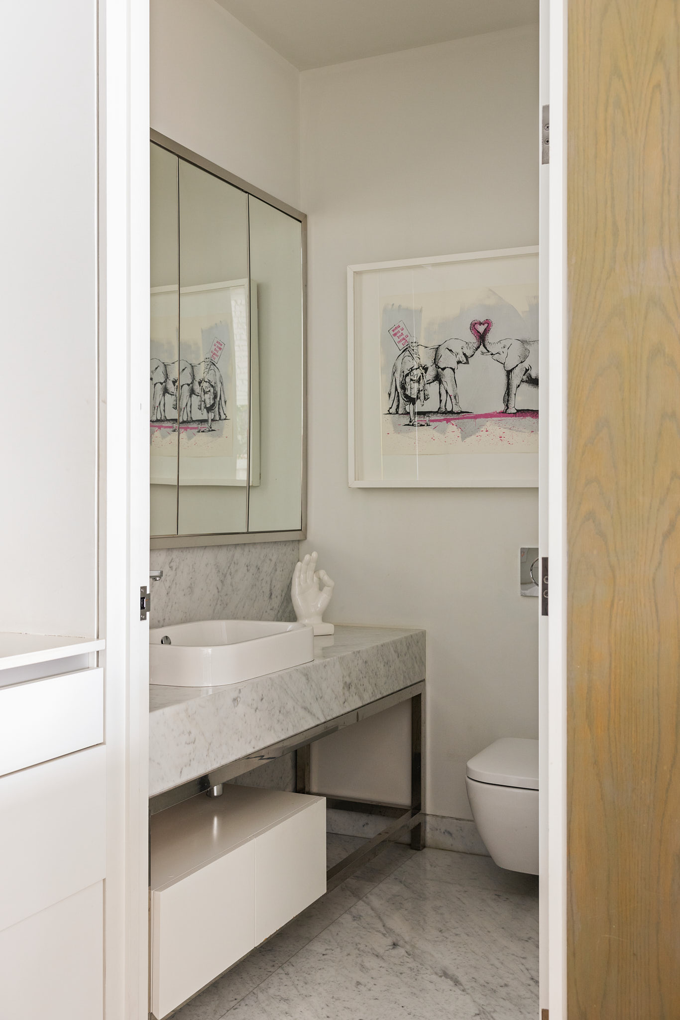 543 Broadway, Unit 6 Manhattan, NY 10012 - Photo 12 of 13 a bathroom with a sink a toilet and shower