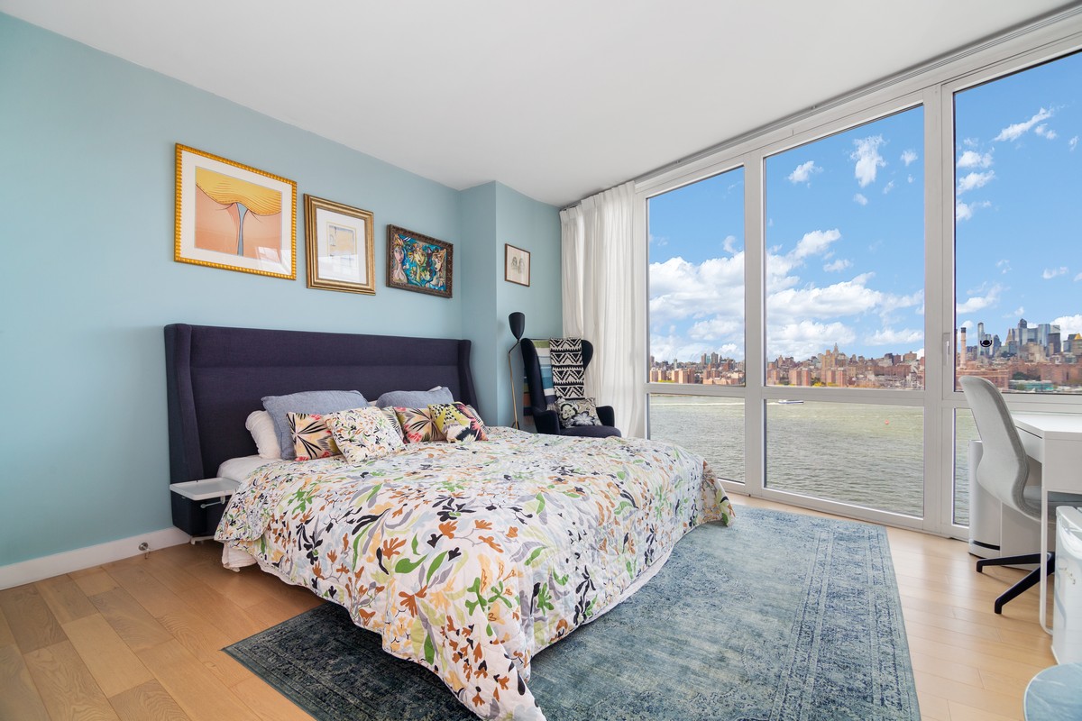 22 North 6th Street, Unit 18D Brooklyn, NY 11249 - Photo 4 of 9 a bedroom with a large bed and a large window