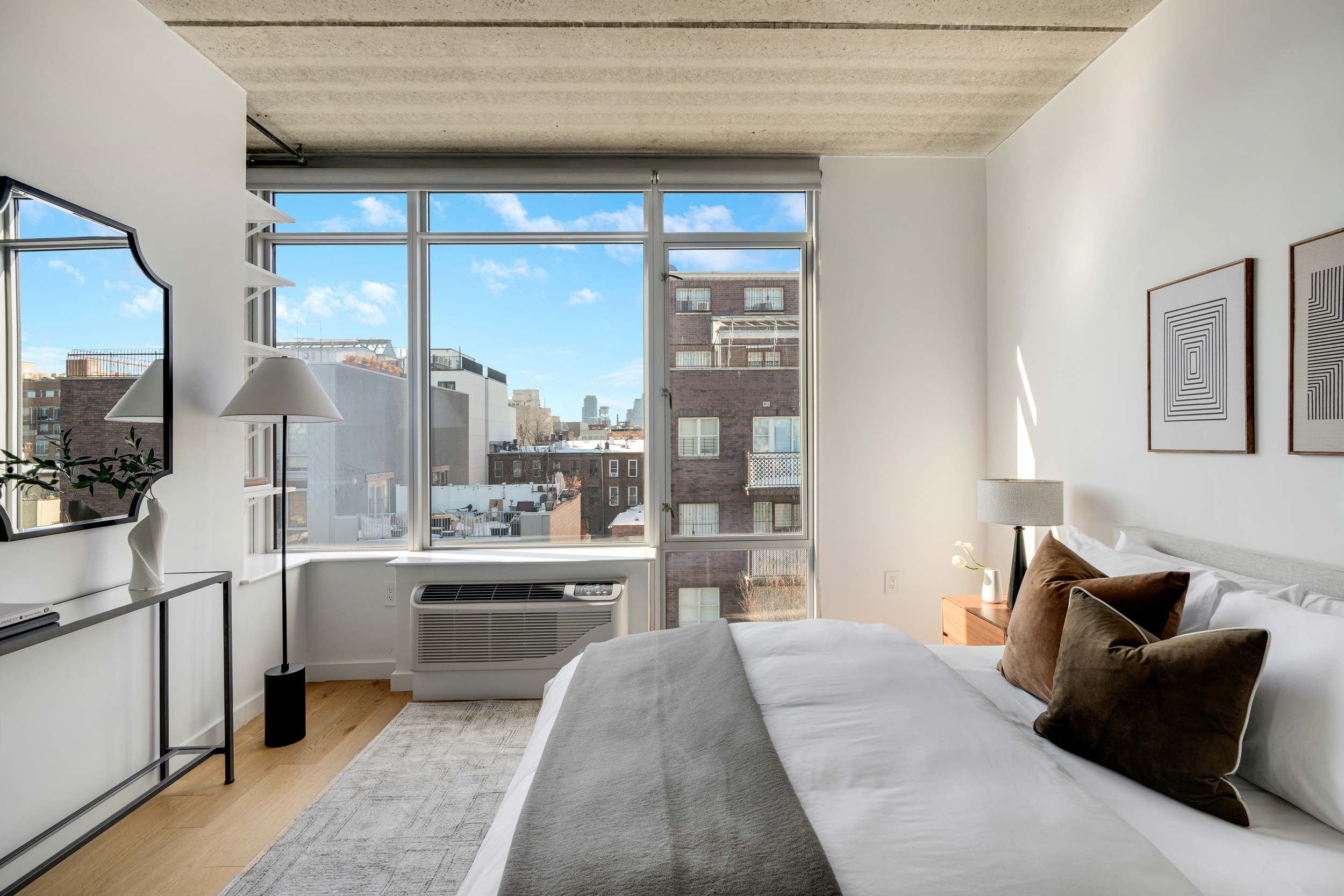 175 Spencer Street, Unit 6B Brooklyn, NY 11205 - Photo 11 of 15 a living room with furniture and a large window