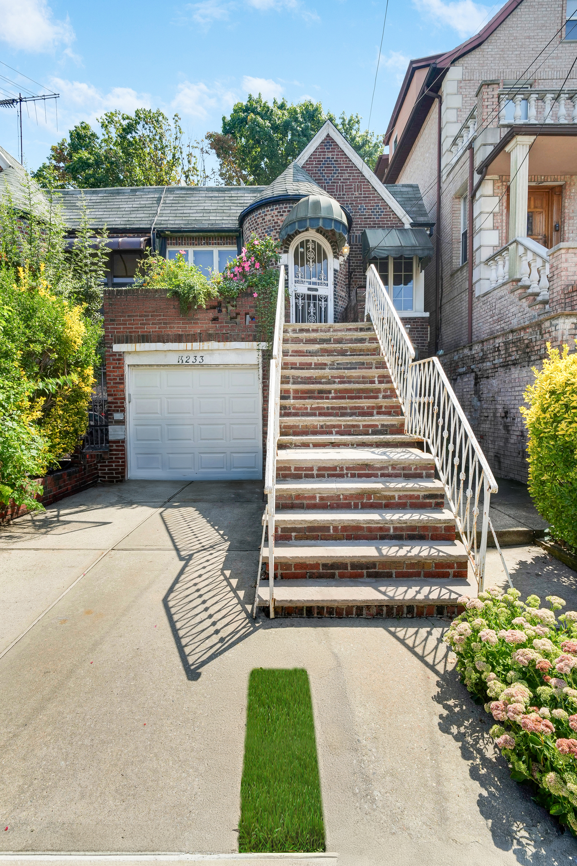 233 Battery Avenue Brooklyn, NY 11209 - Photo 16 of 17 a front view of a house with a yard