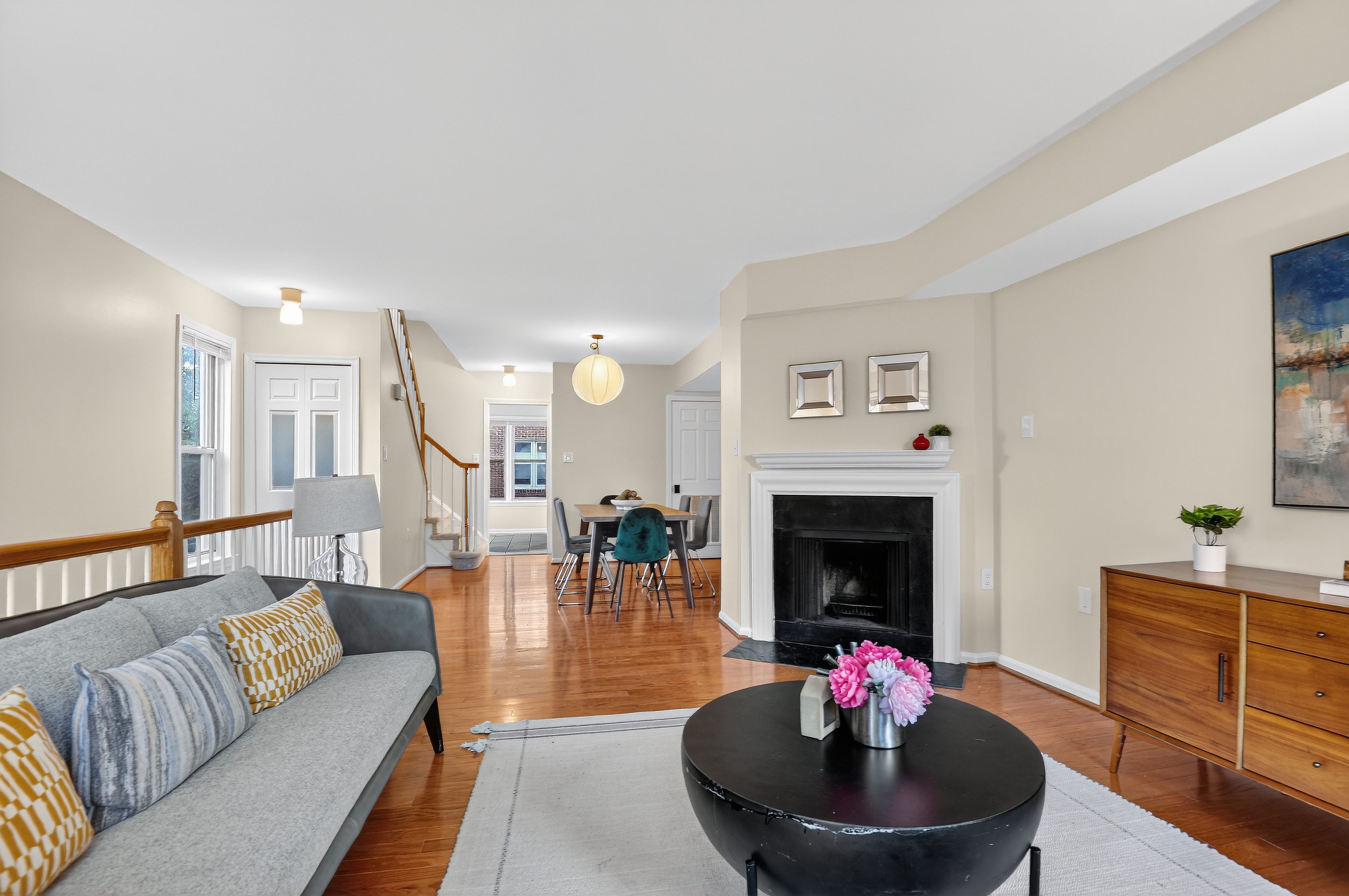 1493 15th Street Northeast, Unit 1493 Washington, DC 20002 - Photo 3 of 26 a living room with furniture a fireplace and a flat screen tv