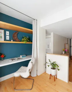 a workspace with furniture and window