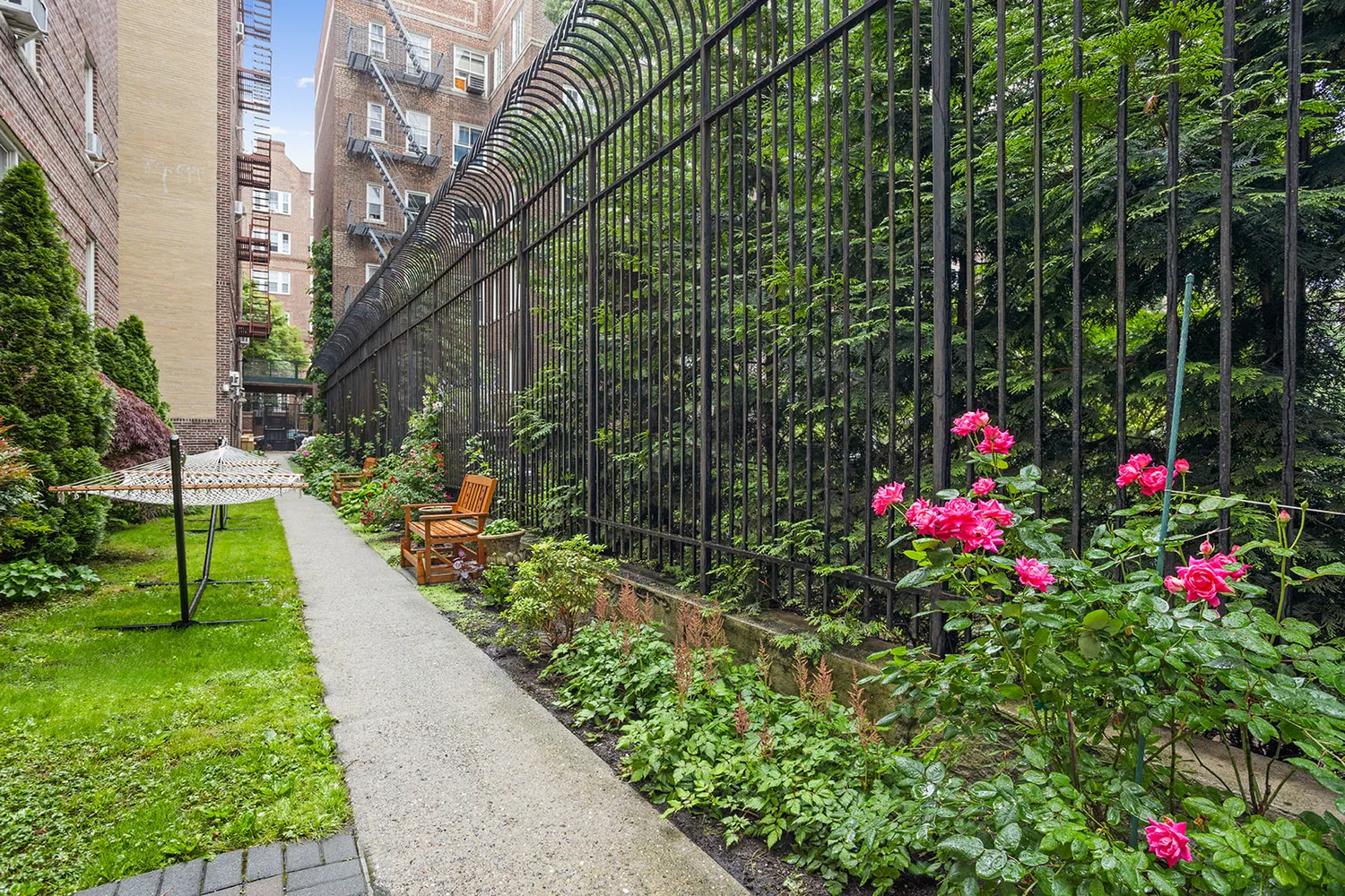a view of flower garden with a small yard