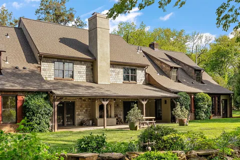 a view of a house with garden and porch