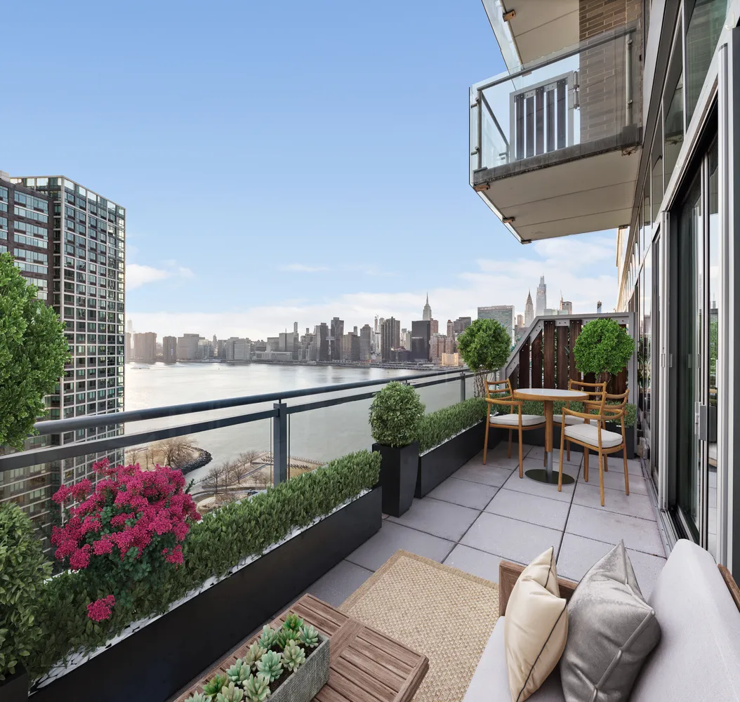 a view of balcony with furniture and flowers