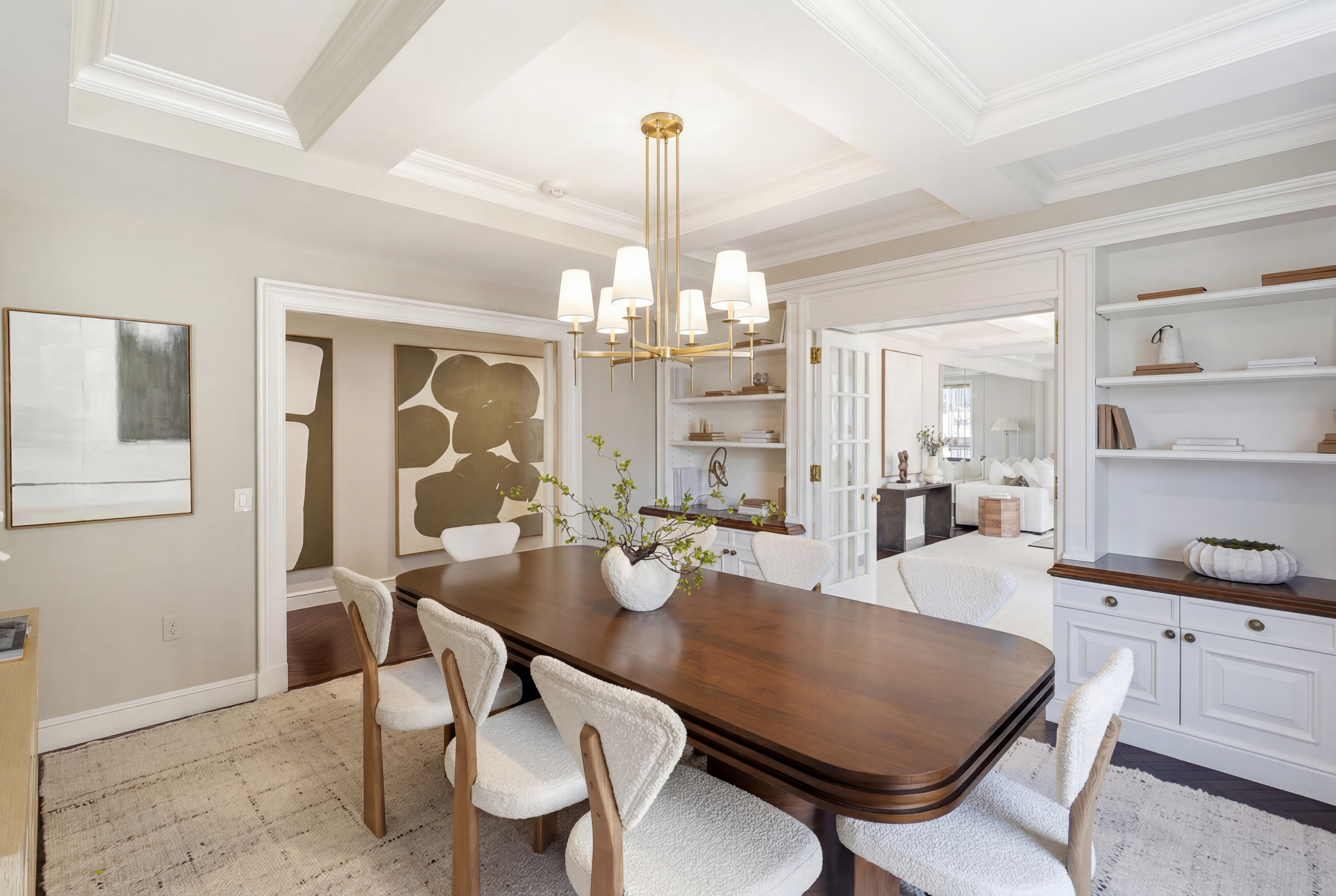 15 East 69th Street, Unit 7A Manhattan, NY 10021 - Photo 9 of 23 a view of a dining room with furniture and chandelier