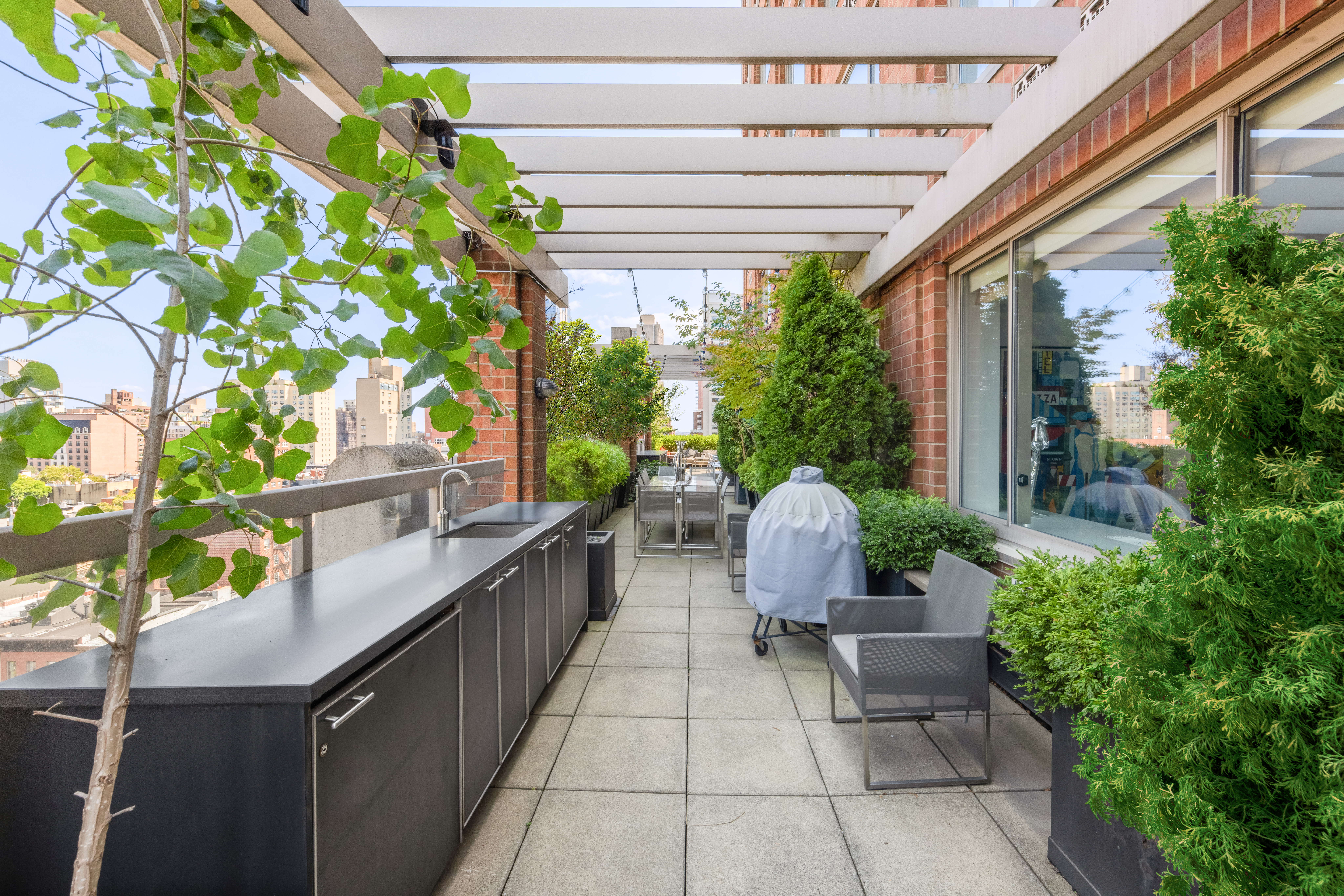 350 East 82nd Street, Unit 14AB Manhattan, NY 10028 - Photo 4 of 21 a view of a chairs and table in the balcony