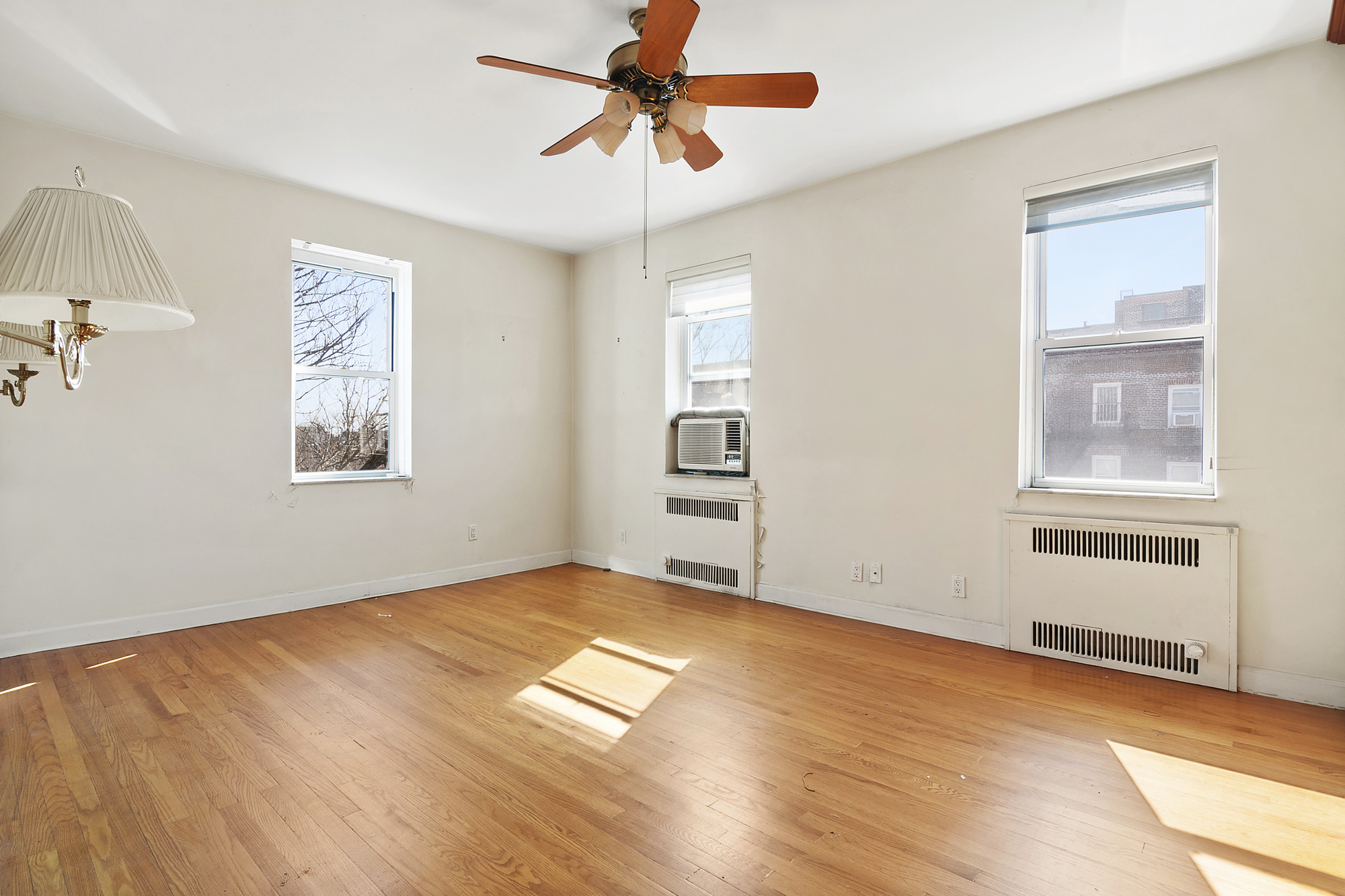 1615 Avenue I, Unit 603 Brooklyn, NY 11230 - Photo 7 of 13 a view of empty room with wooden floor and fan