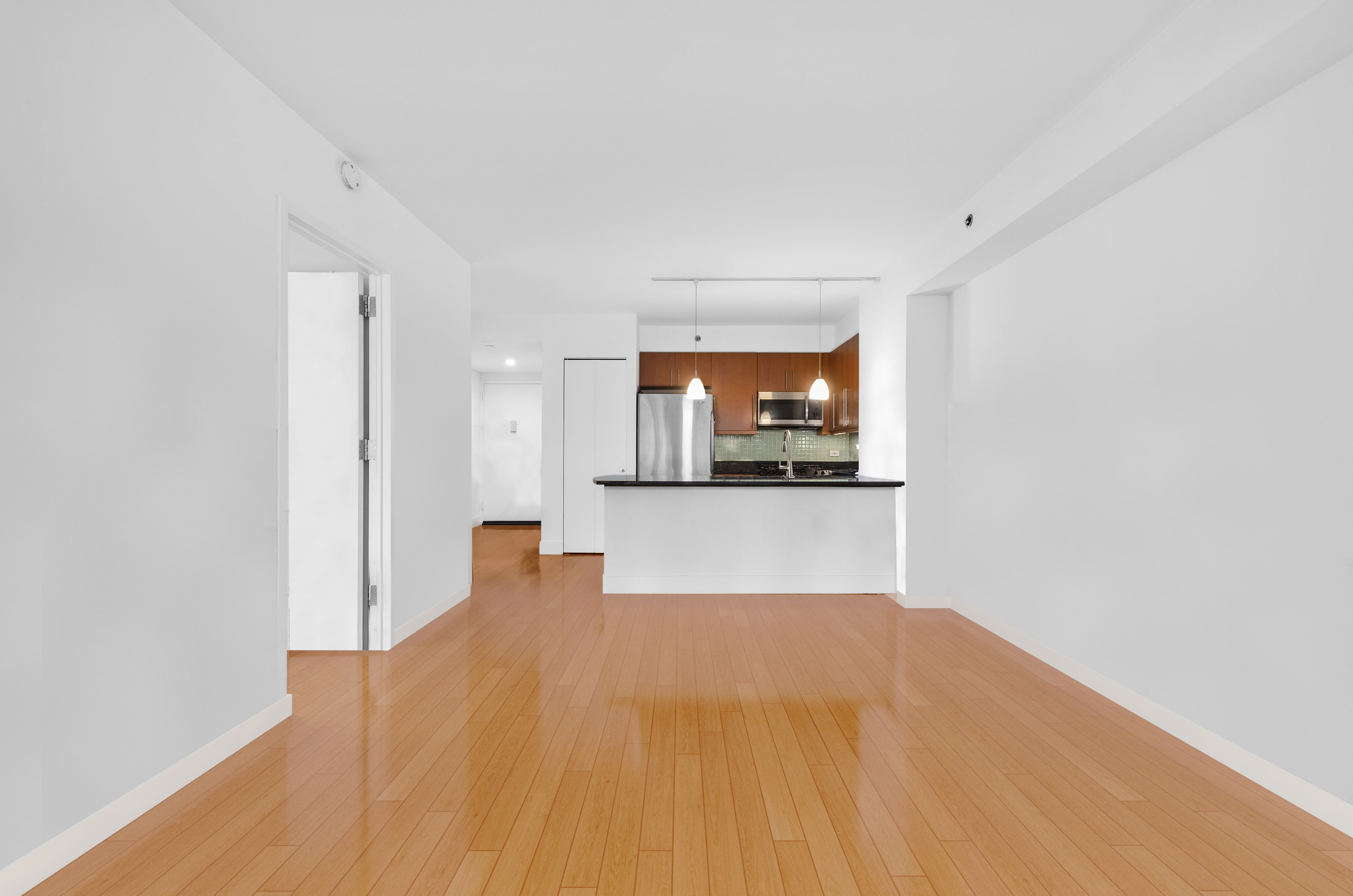 242 East 25th Street, Unit 5B Manhattan, NY 10010 - Photo 2 of 12 a view of a room with wooden floor and a window