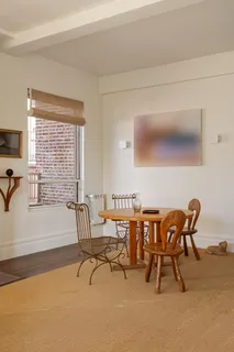 a kitchen with granite countertop a stove a sink and a refrigerator