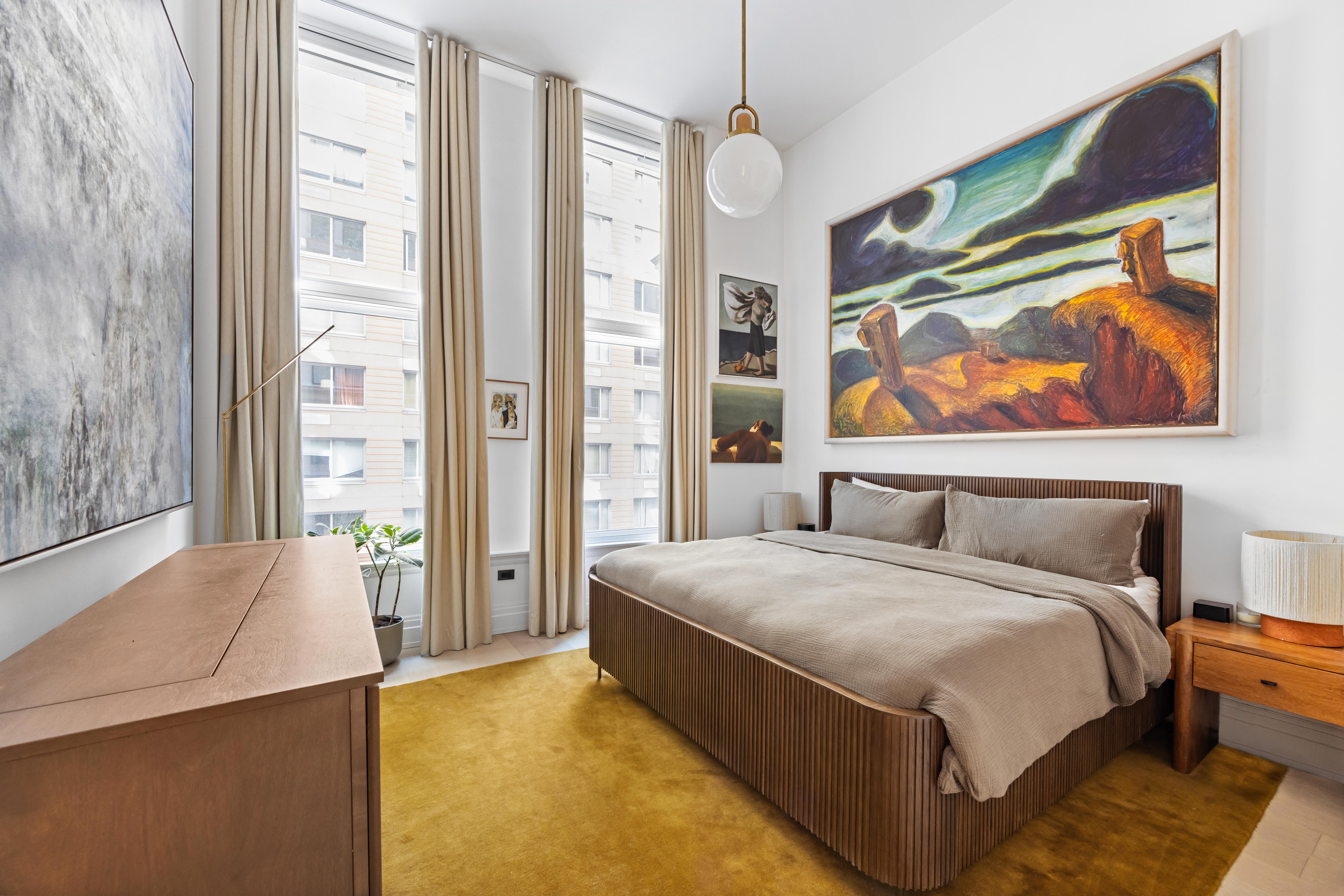 108 Leonard Street, Unit 4K Manhattan, NY 10013 - Photo 6 of 11 a bedroom with a bed and a painting on the wall