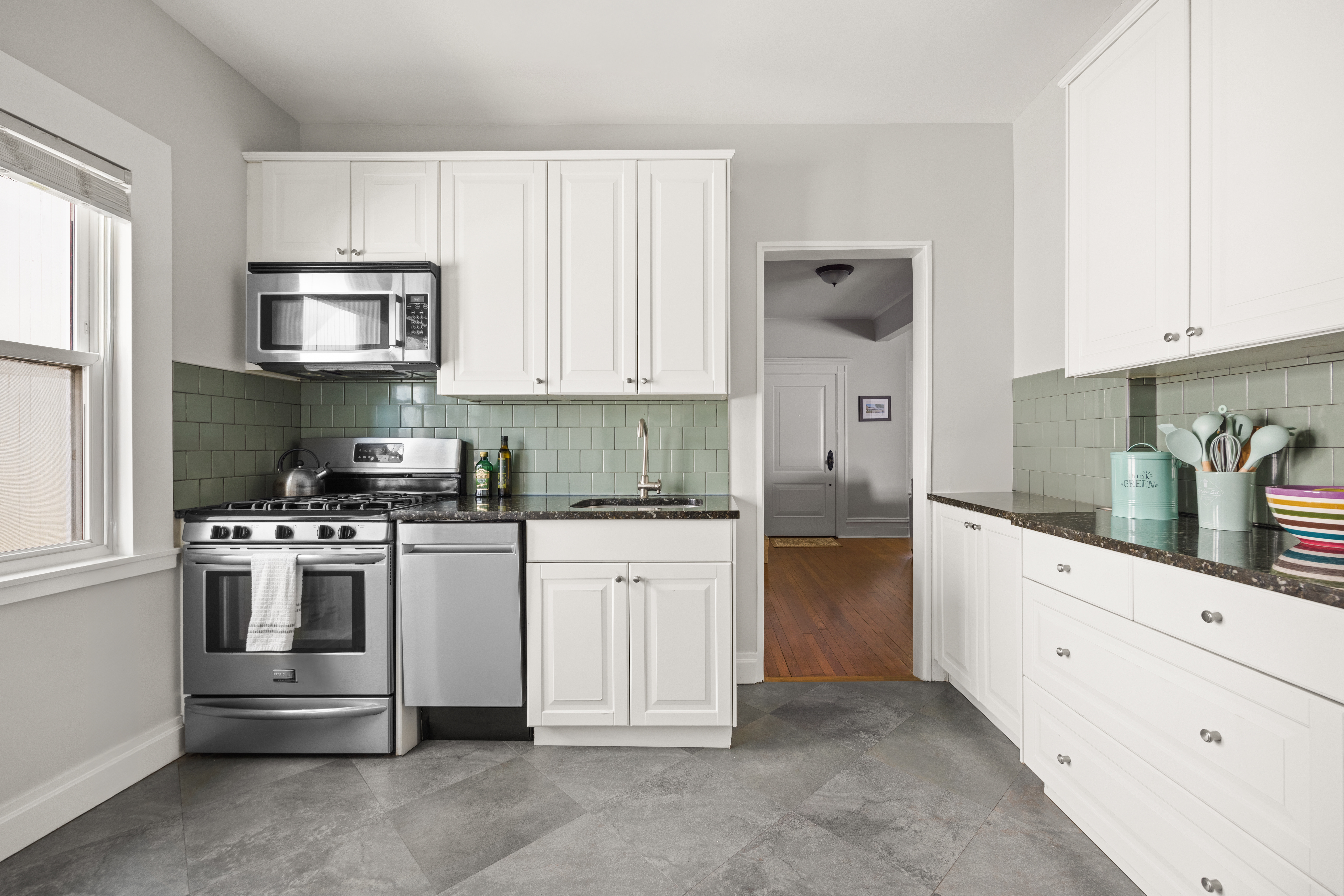758 Westminster Road Brooklyn, NY 11230 - Photo 23 of 32 a kitchen with stainless steel appliances granite countertop a stove and a refrigerator
