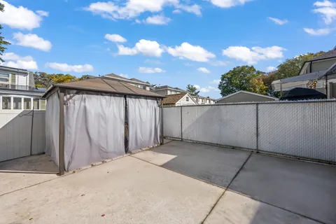 a view of a house with a large window and stairs