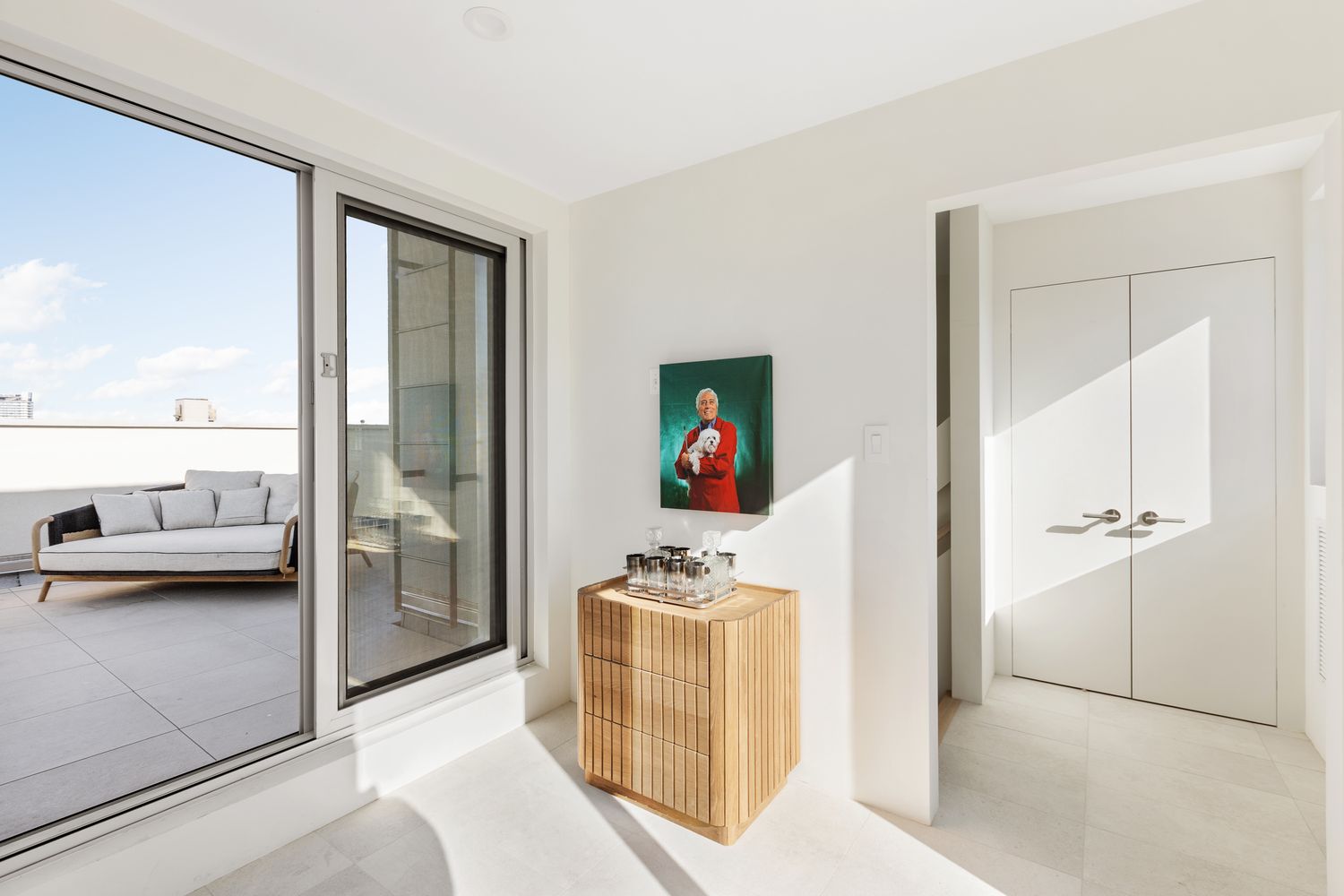 a view of living room filled with furniture and large window