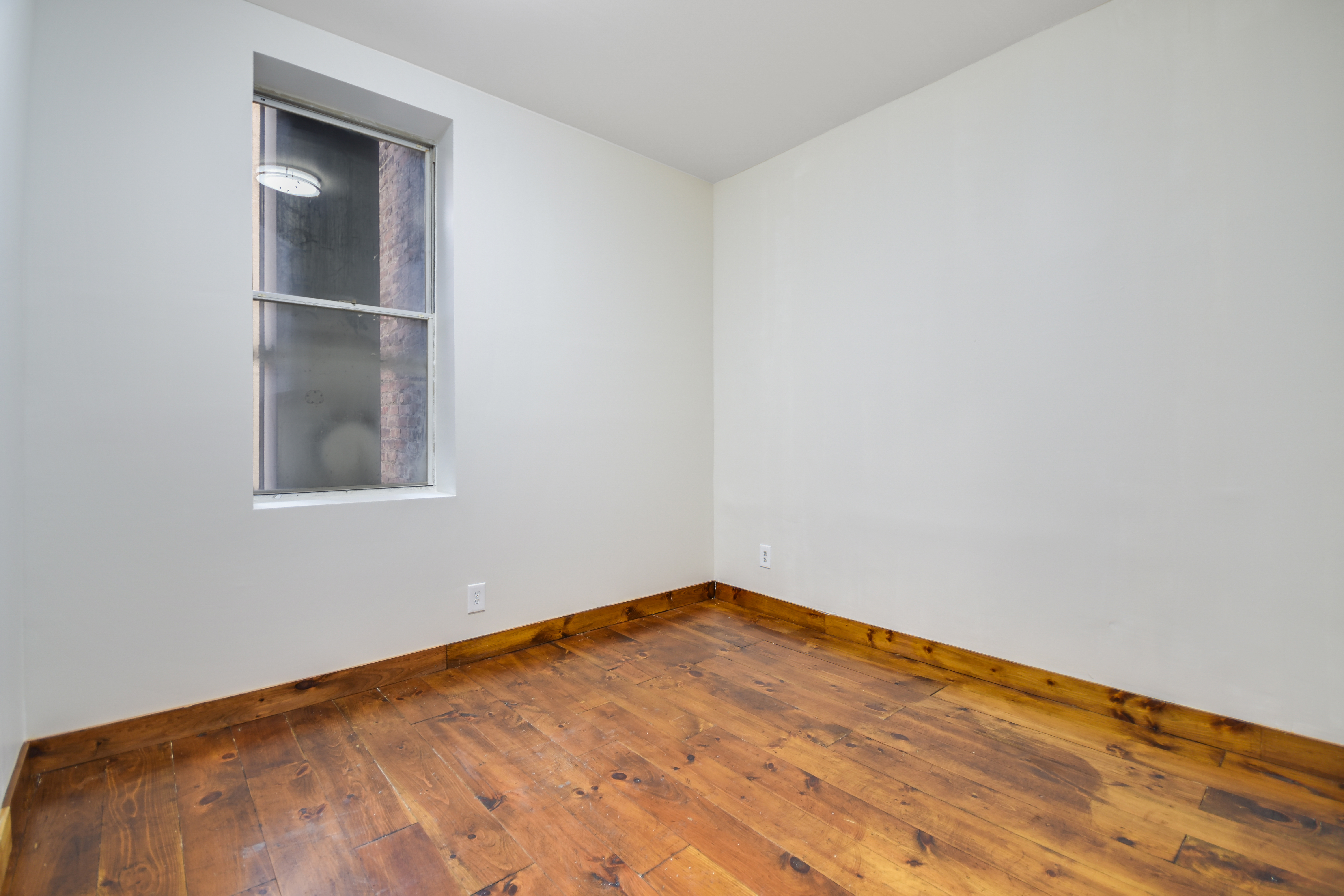329 Broome Street, Unit 2R Manhattan, NY 10002 - Photo 4 of 6 a view of empty room