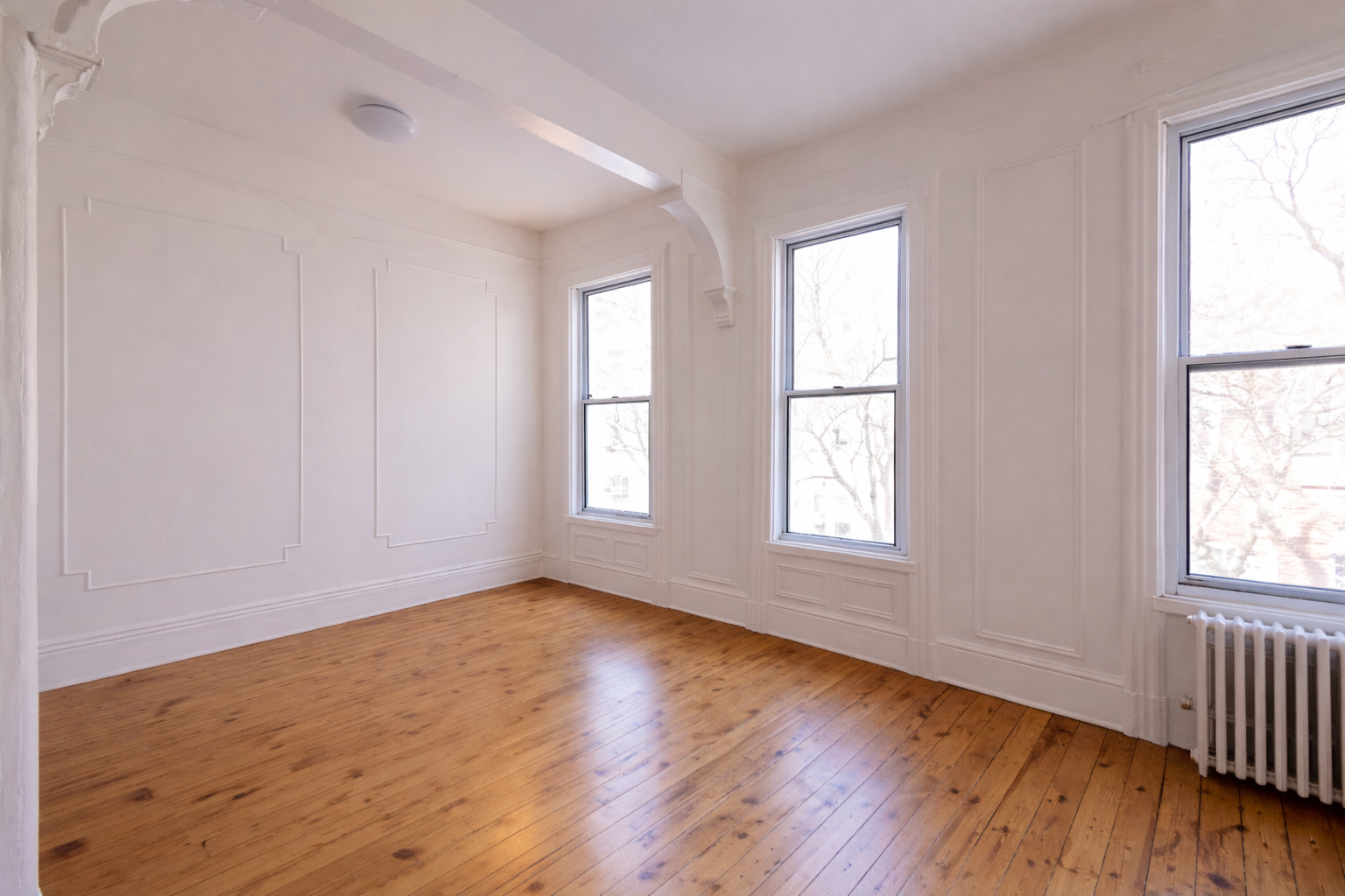 40 A Jewel Street, Unit 2 Brooklyn, NY 11222 - Photo 3 of 10 an empty room with wooden floor and windows