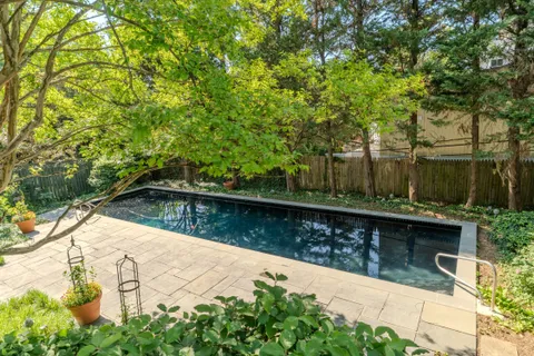 a view of swimming pool with a yard