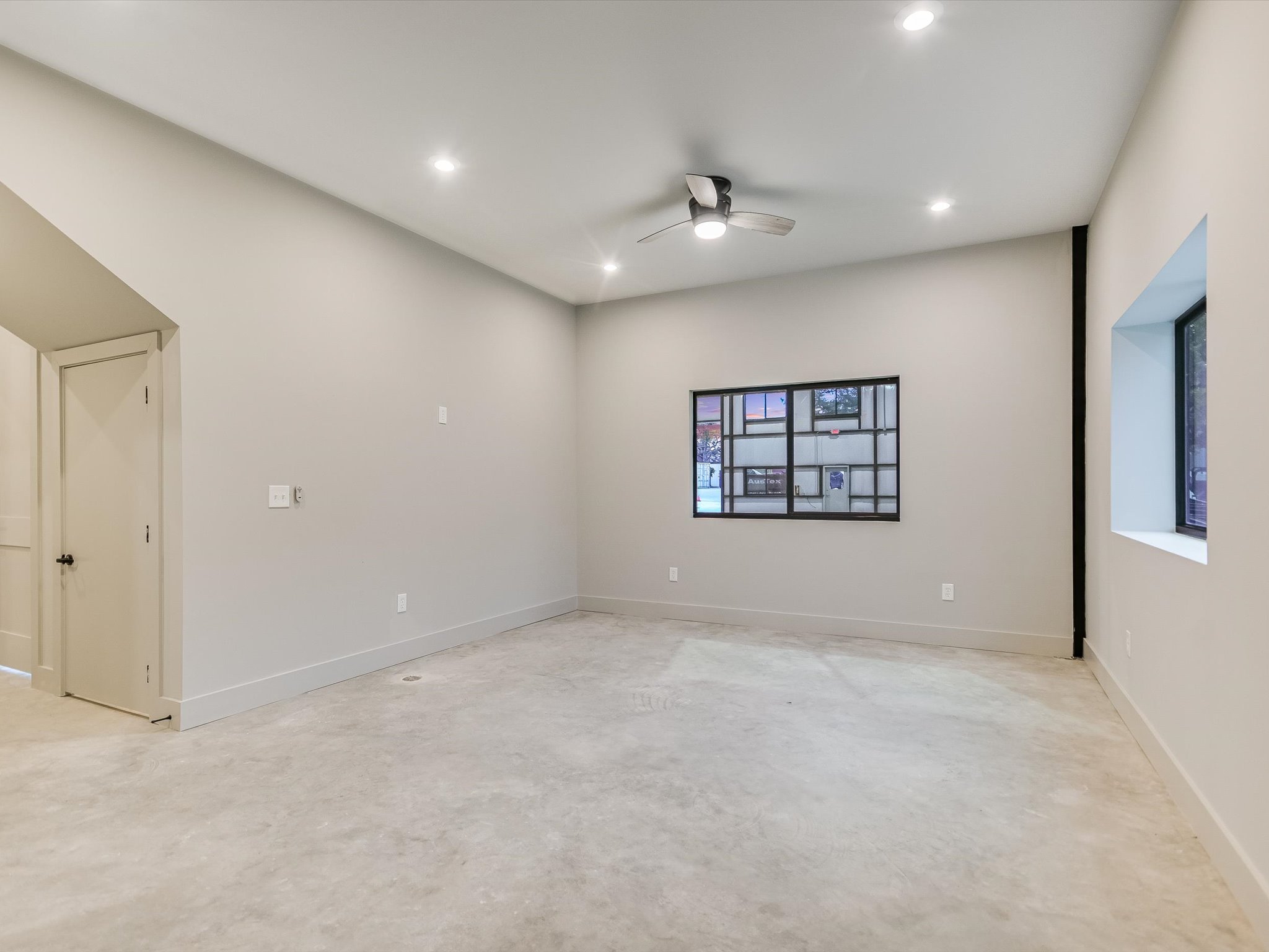 15210 Fitzhugh Road, Unit 800 Austin, TX 78736 - Photo 8 of 18 an empty room with windows and ceiling fan